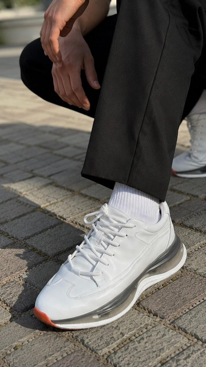 Pair of men's white leather trainer sneakers, full view