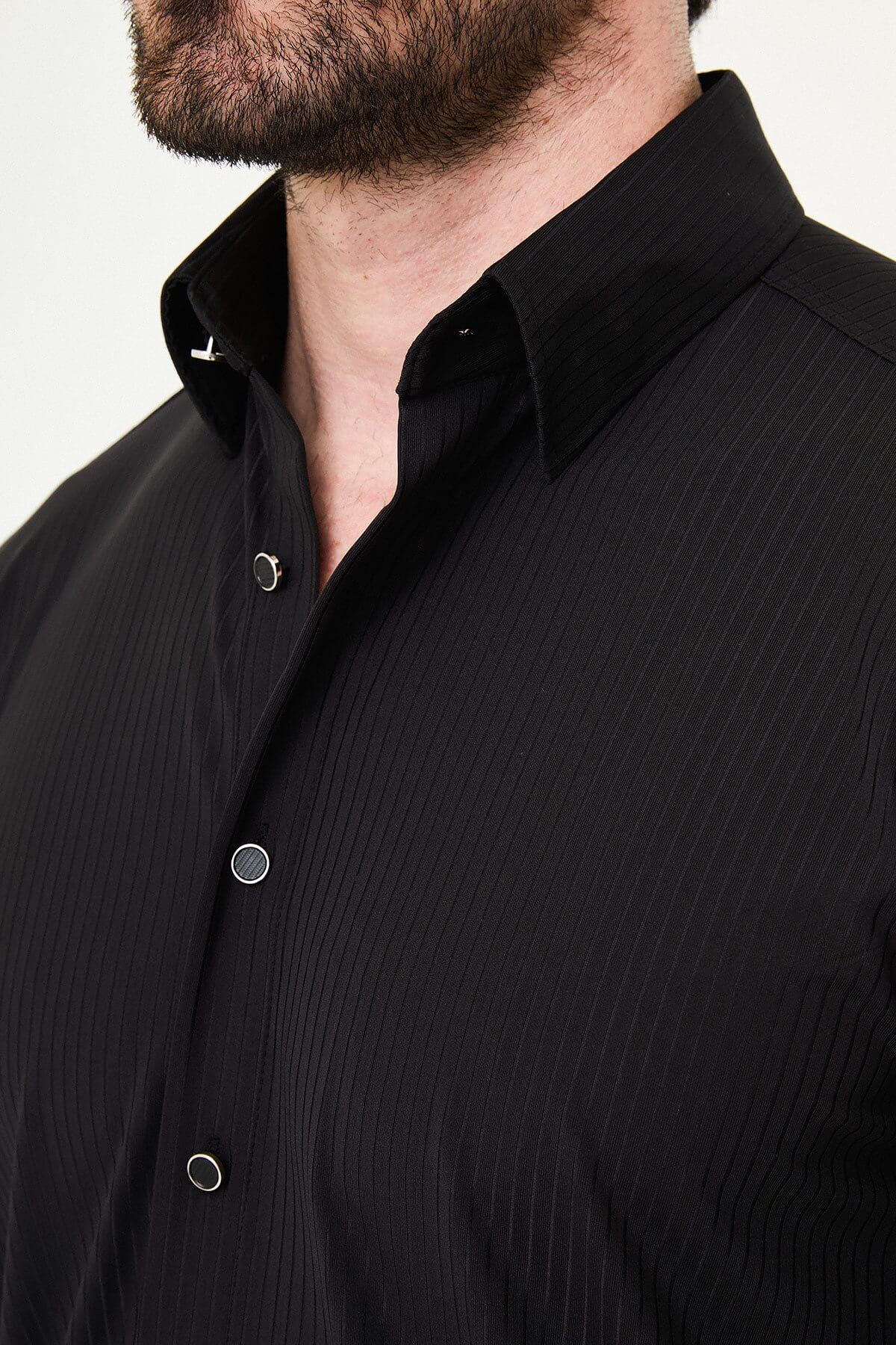 Men wearing a black textured slim-fit long sleeve striped shirt, styled for smart-casual summer wear.