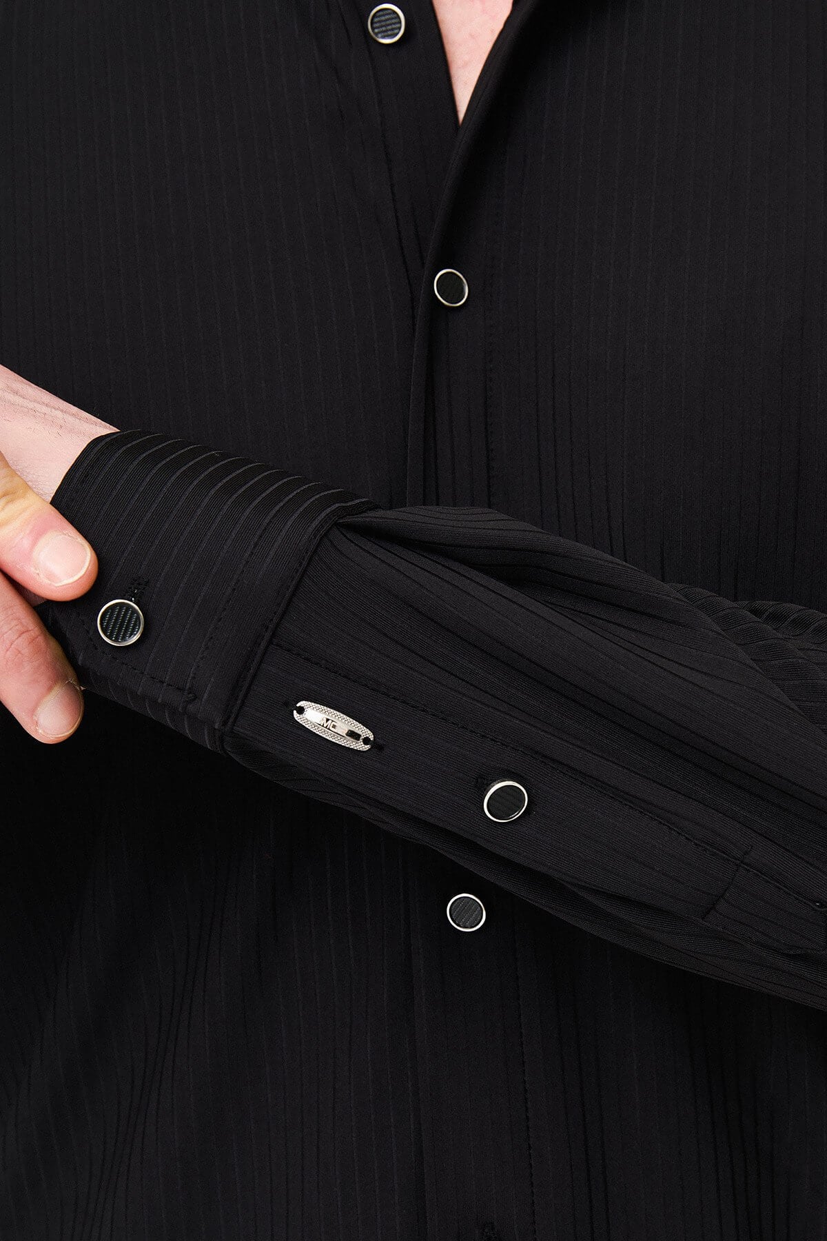 Men wearing a black textured slim-fit long sleeve striped shirt, styled for smart-casual summer wear.