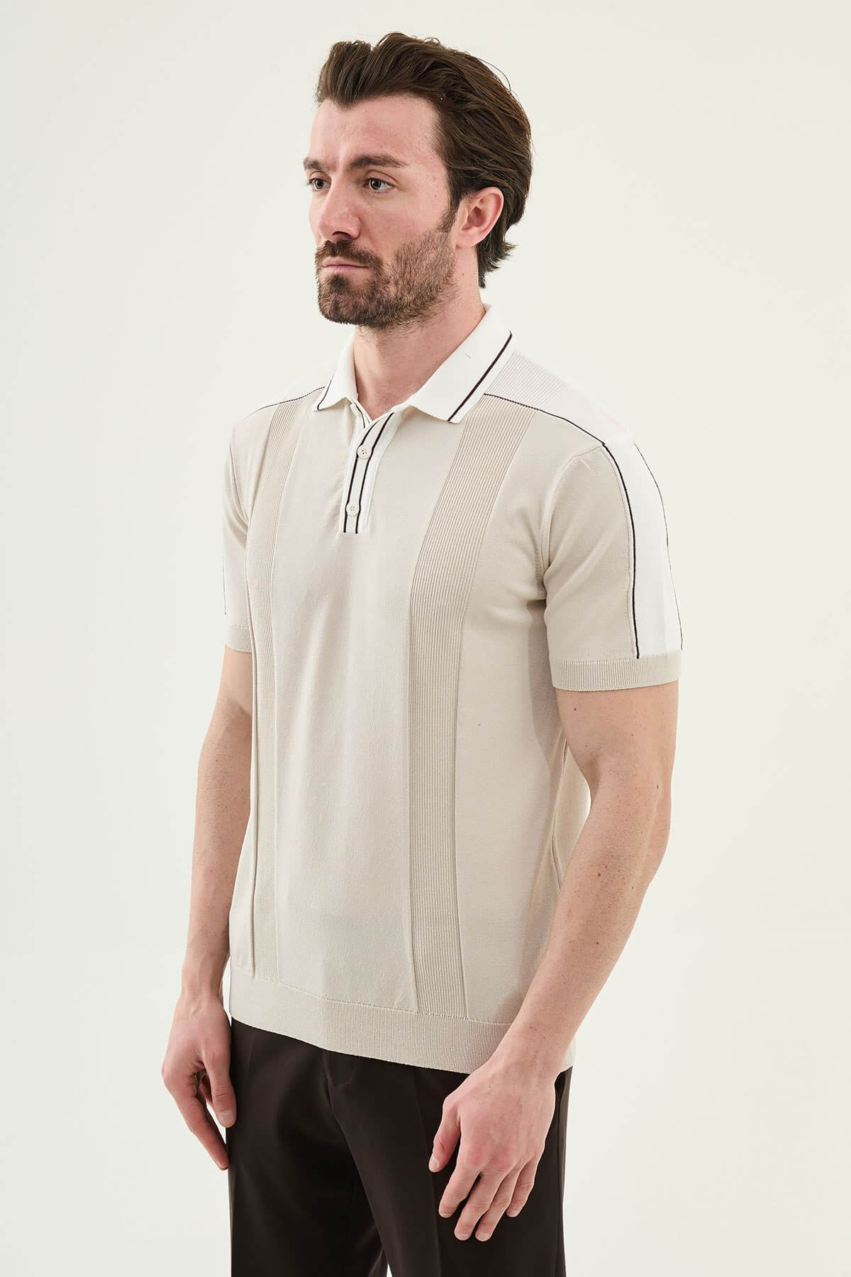 Men’s beige colorblock slim fit knit polo shirt with contrast collar styled for a refined summer smart-casual outfit.