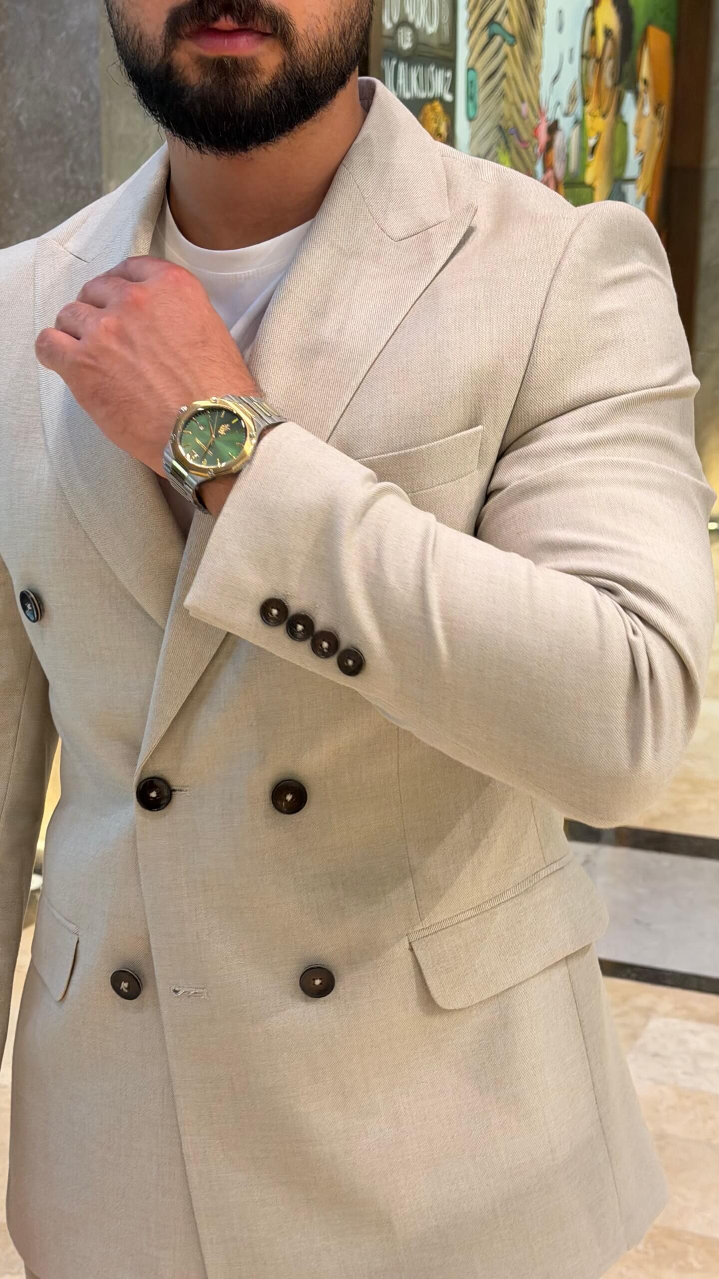 Men's beige double breasted suit with tailored jacket and matching trousers