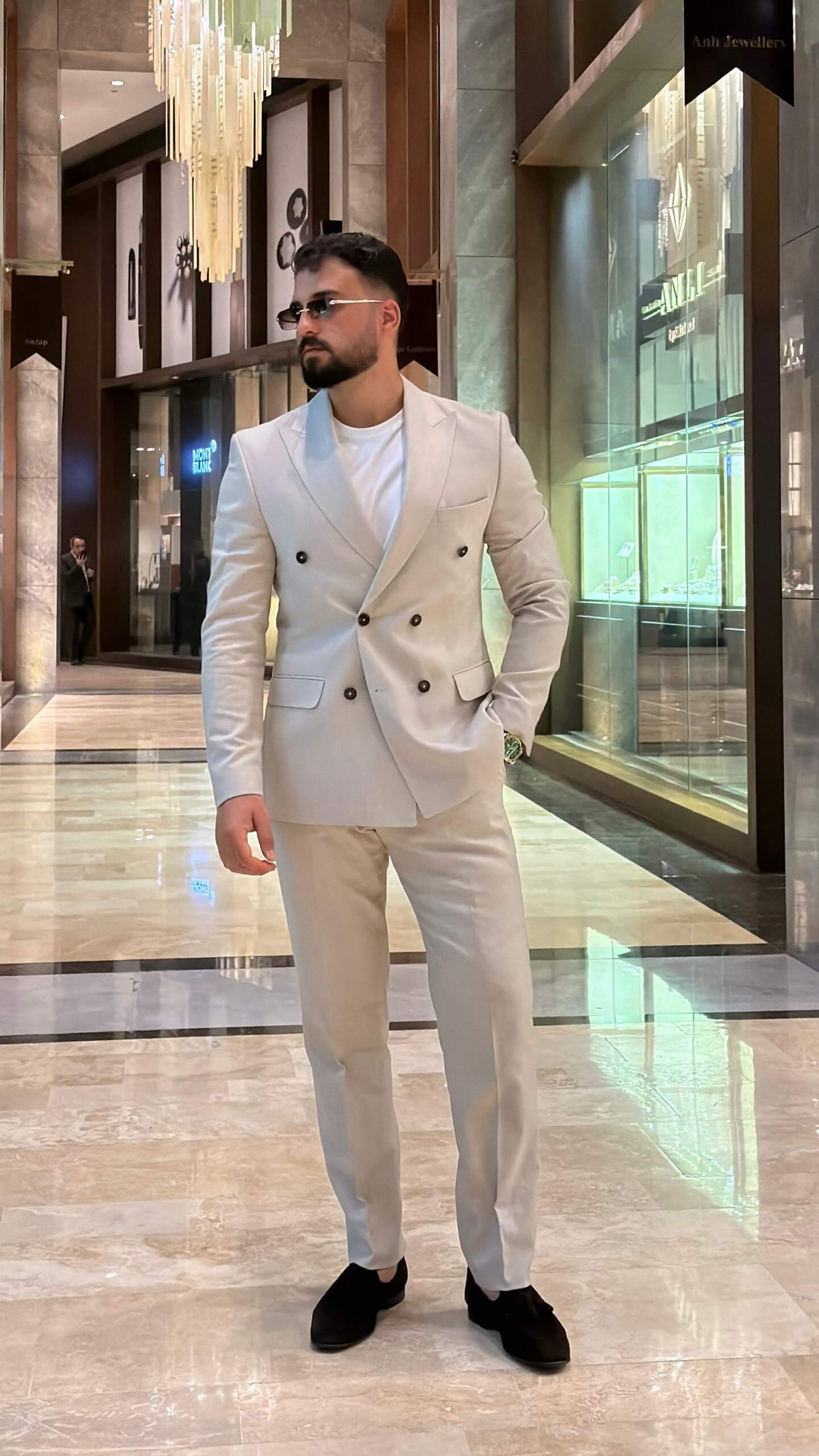 Men's beige double breasted suit with tailored jacket and matching trousers