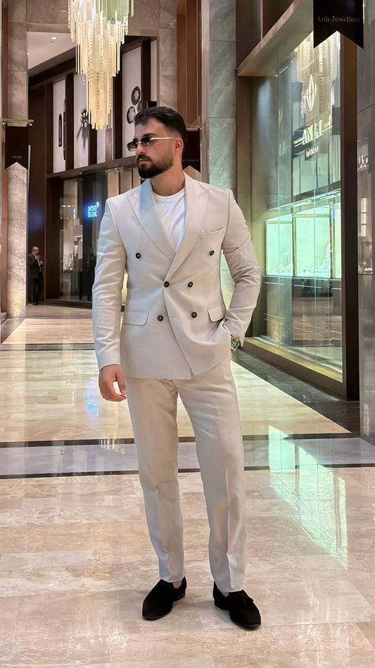 Men's beige double breasted suit with tailored jacket and matching trousers