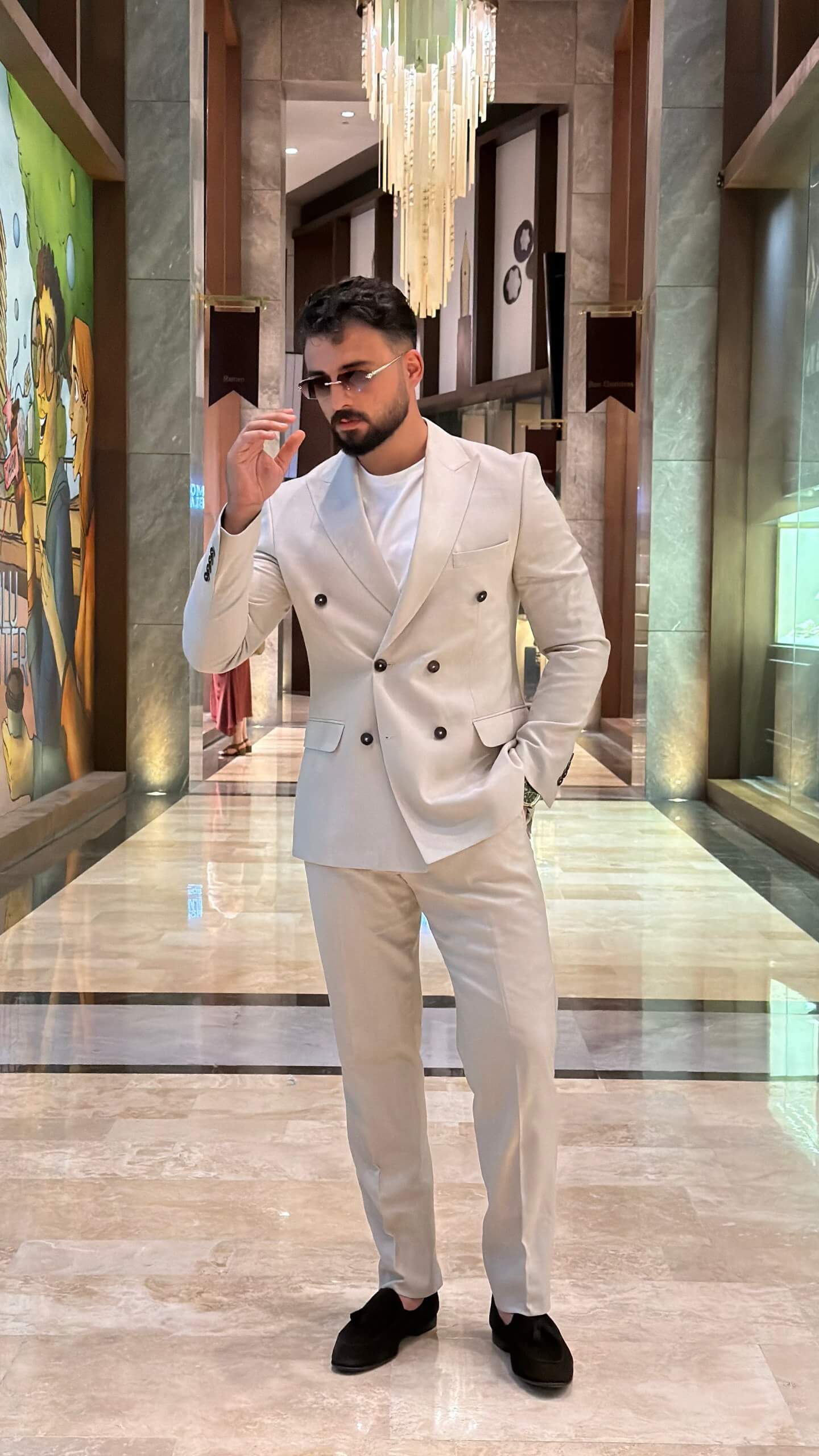 Men's beige double breasted suit with tailored jacket and matching trousers