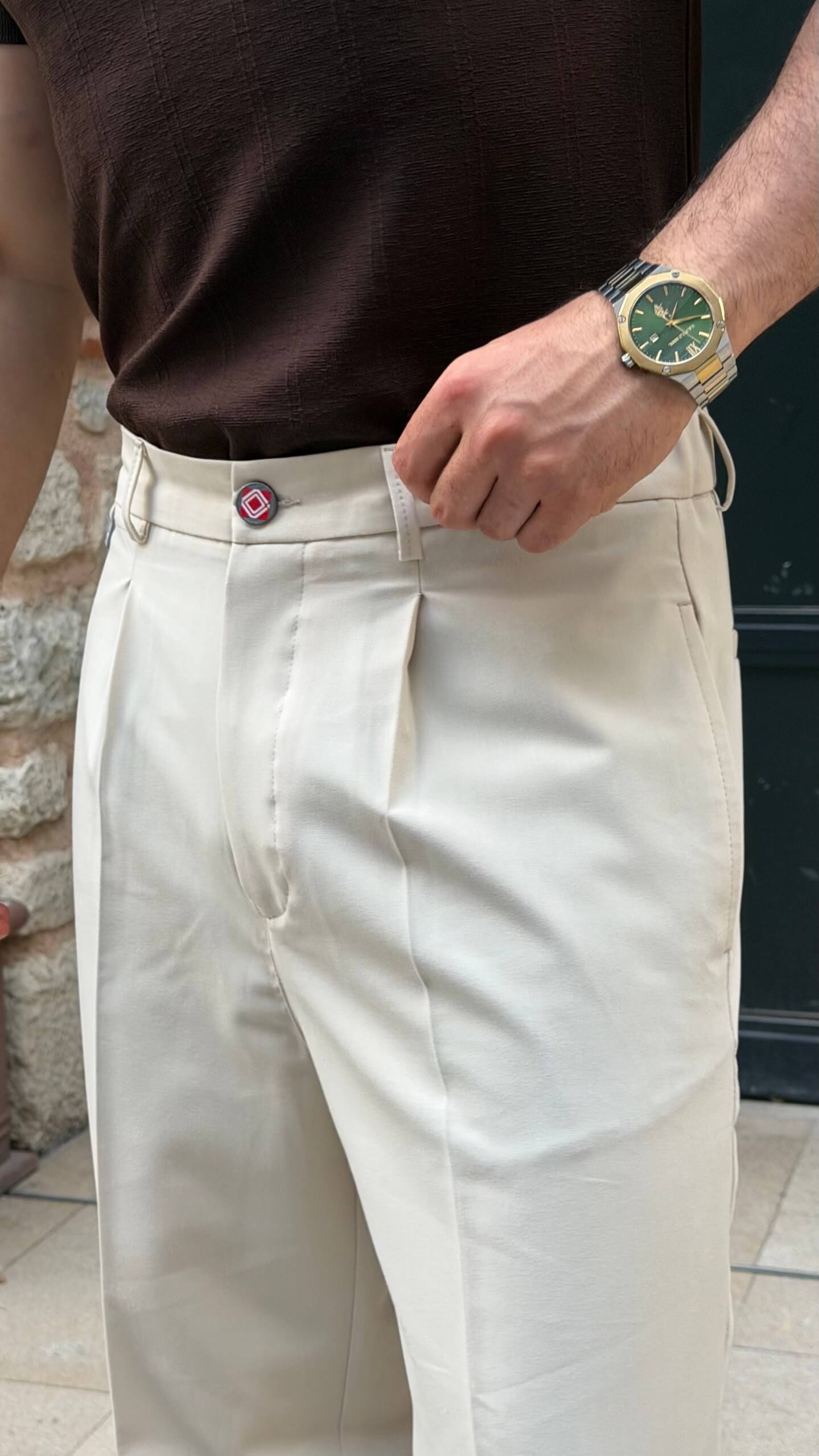 Beige pleated tailored trousers with tapered leg, front view
