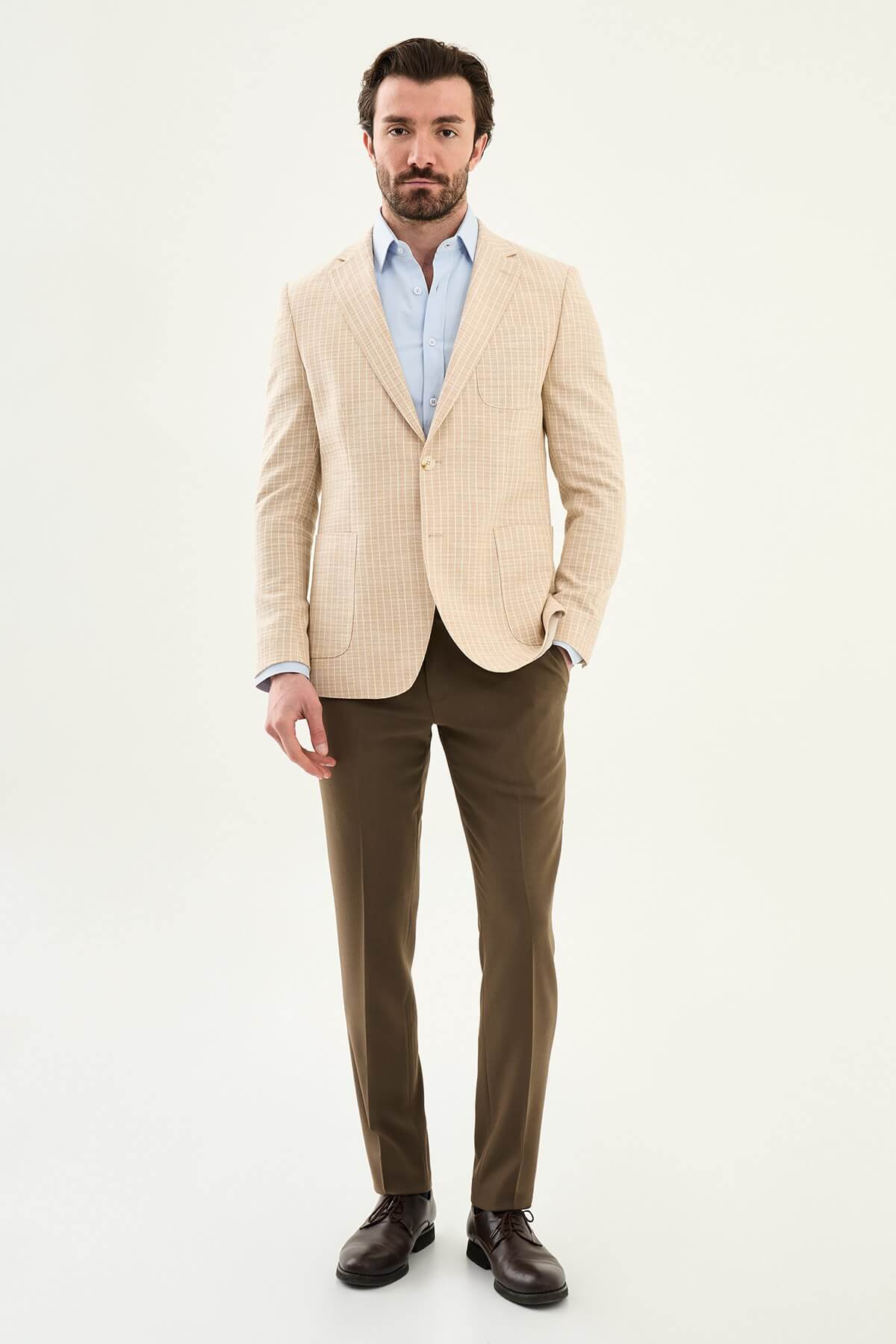 Men’s beige slim fit cotton linen blazer with a lightweight textured finish, tailored for smart casual and formal summer styling.