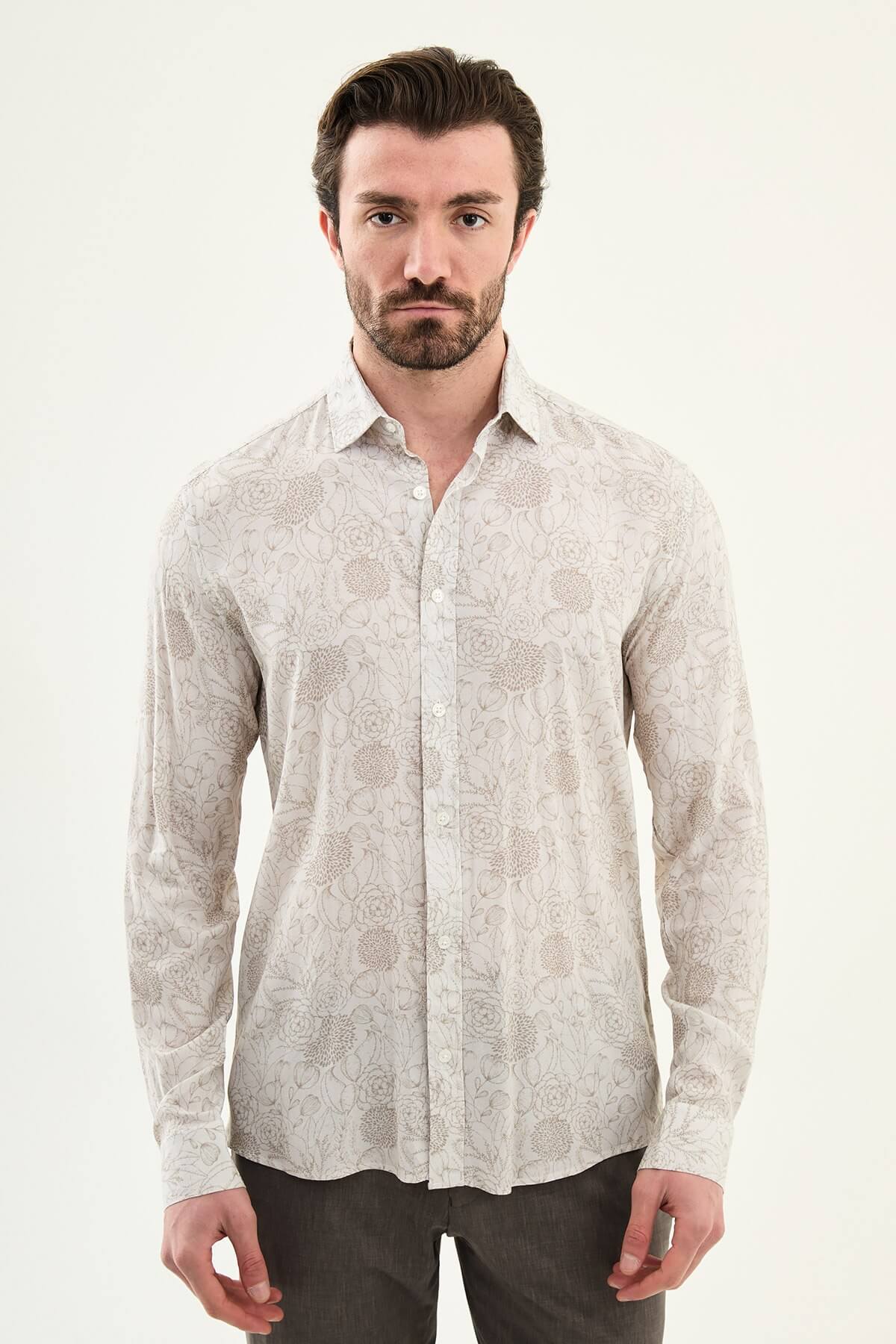 Men wearing a beige floral patterned slim-fit shirt, long sleeves, standing straight against a plain background