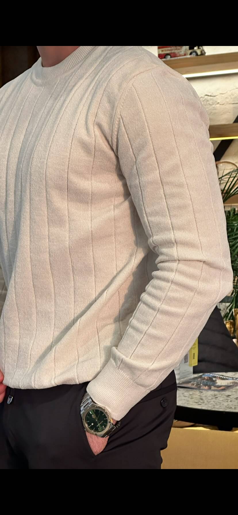 Men’s ecru ribbed crewneck cotton sweater styled with black trousers for fall winter fashion