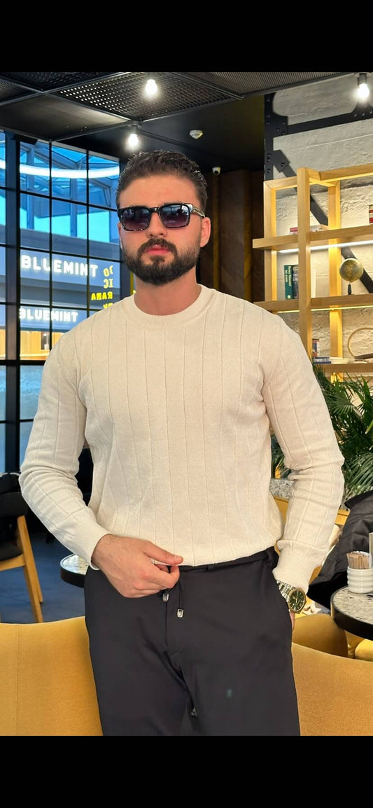 Men’s ecru ribbed crewneck cotton sweater styled with black trousers for fall winter fashion