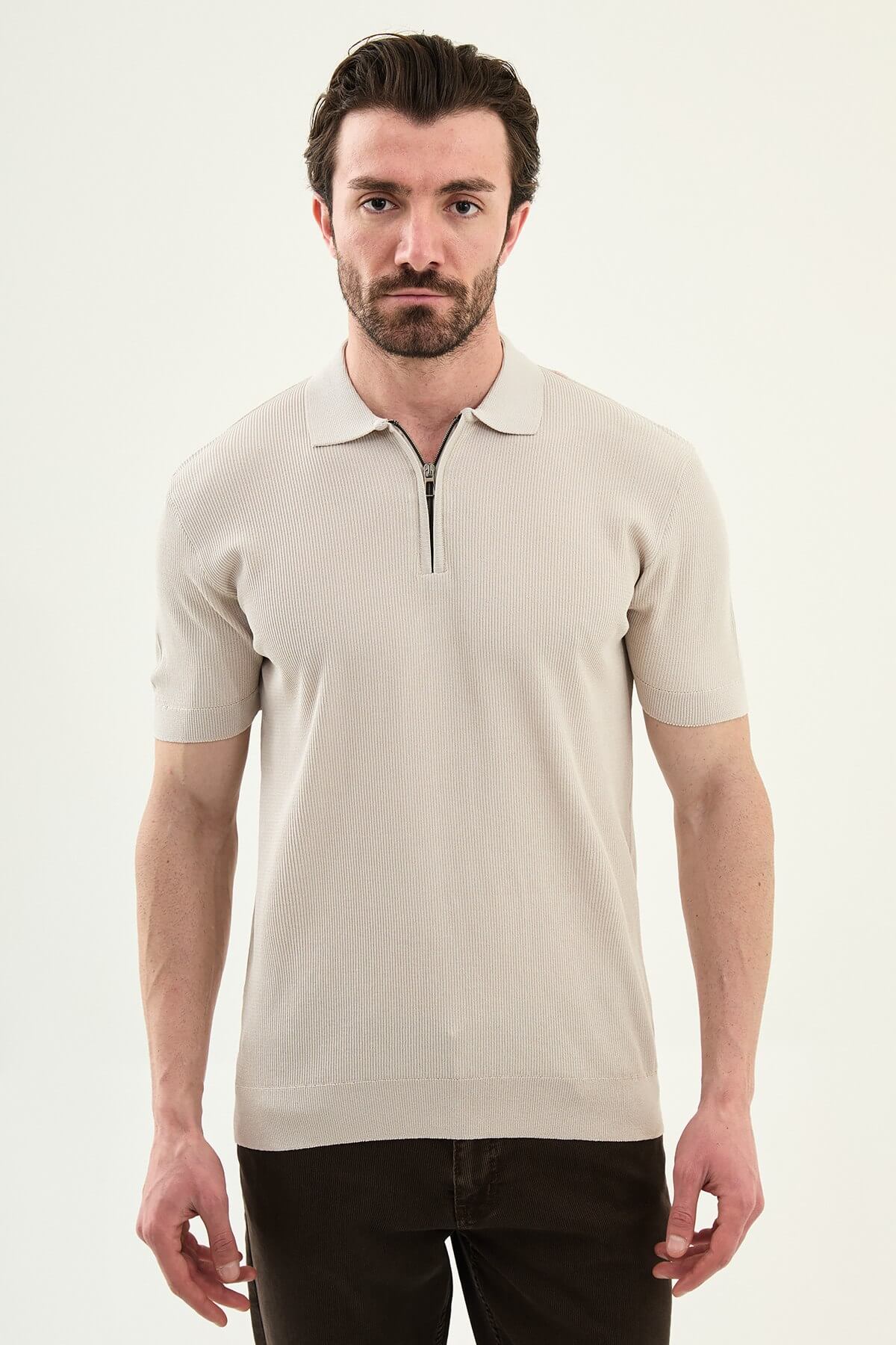 Men’s beige slim-fit knit polo shirt with classic collar, short sleeves, and textured knit finish for summer smart-casual style.