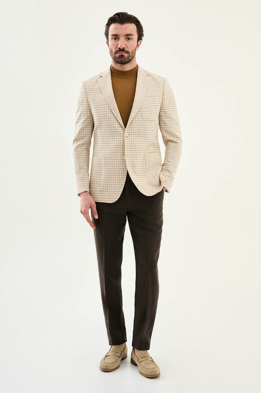 Men’s beige slim fit cotton linen blazer with a lightweight textured pattern, styled for smart casual and elegant summer occasions.
