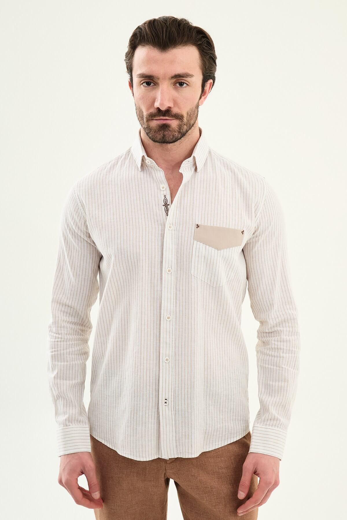 beige slim-fit long sleeve shirt with subtle stripe detailing, pocket accent, and tailored cuffs, paired with light trousers