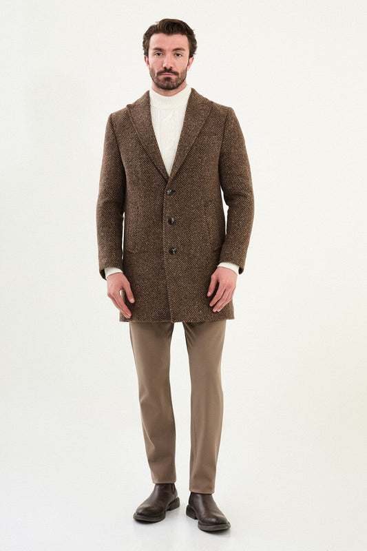 Beige herringbone wool blend men’s coat styled with cream knit sweater