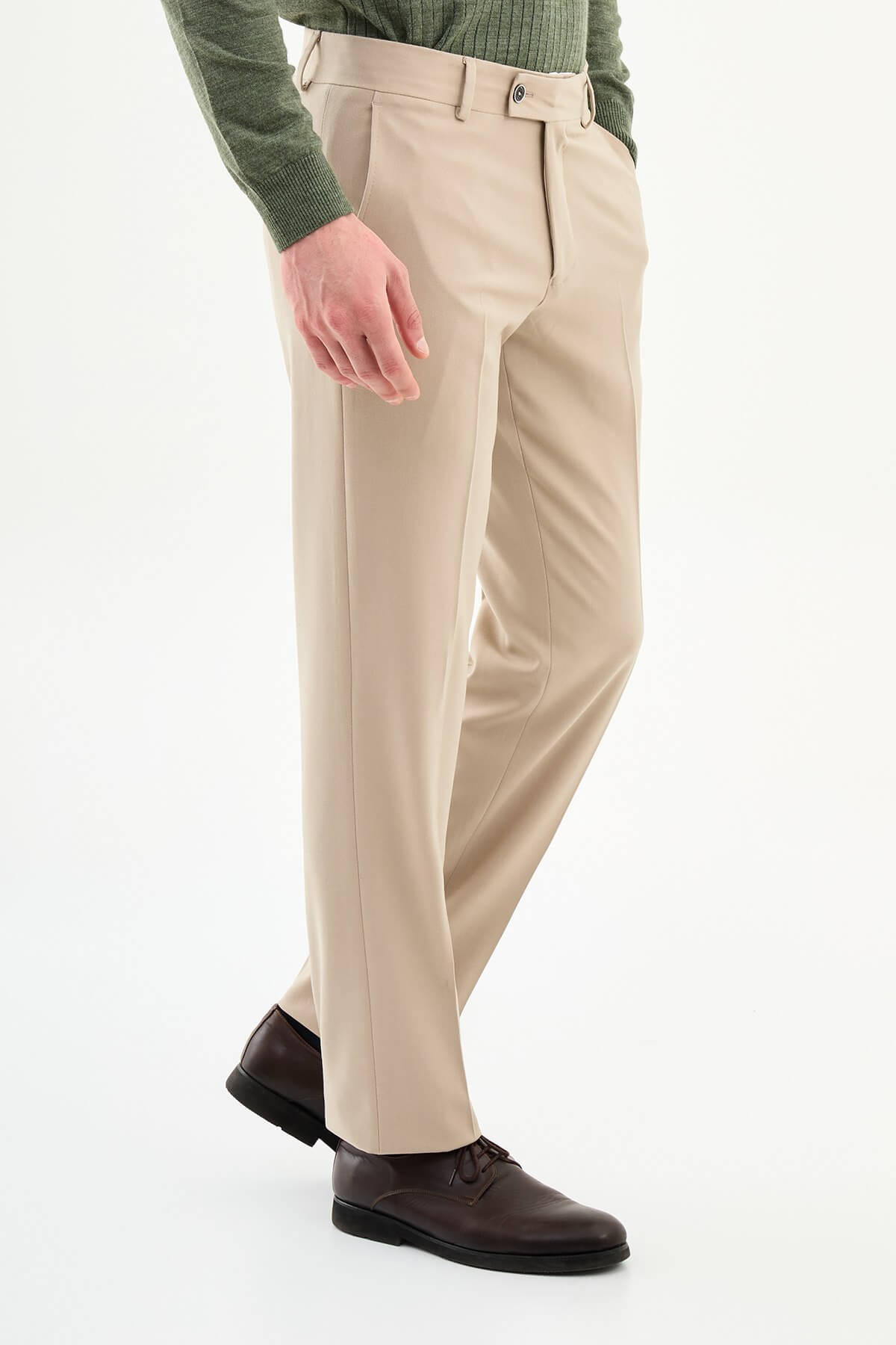 Beige slim-fit formal trousers with subtle pleats, styled with dress shoes, perfect for summer smart-casual and formal occasions.