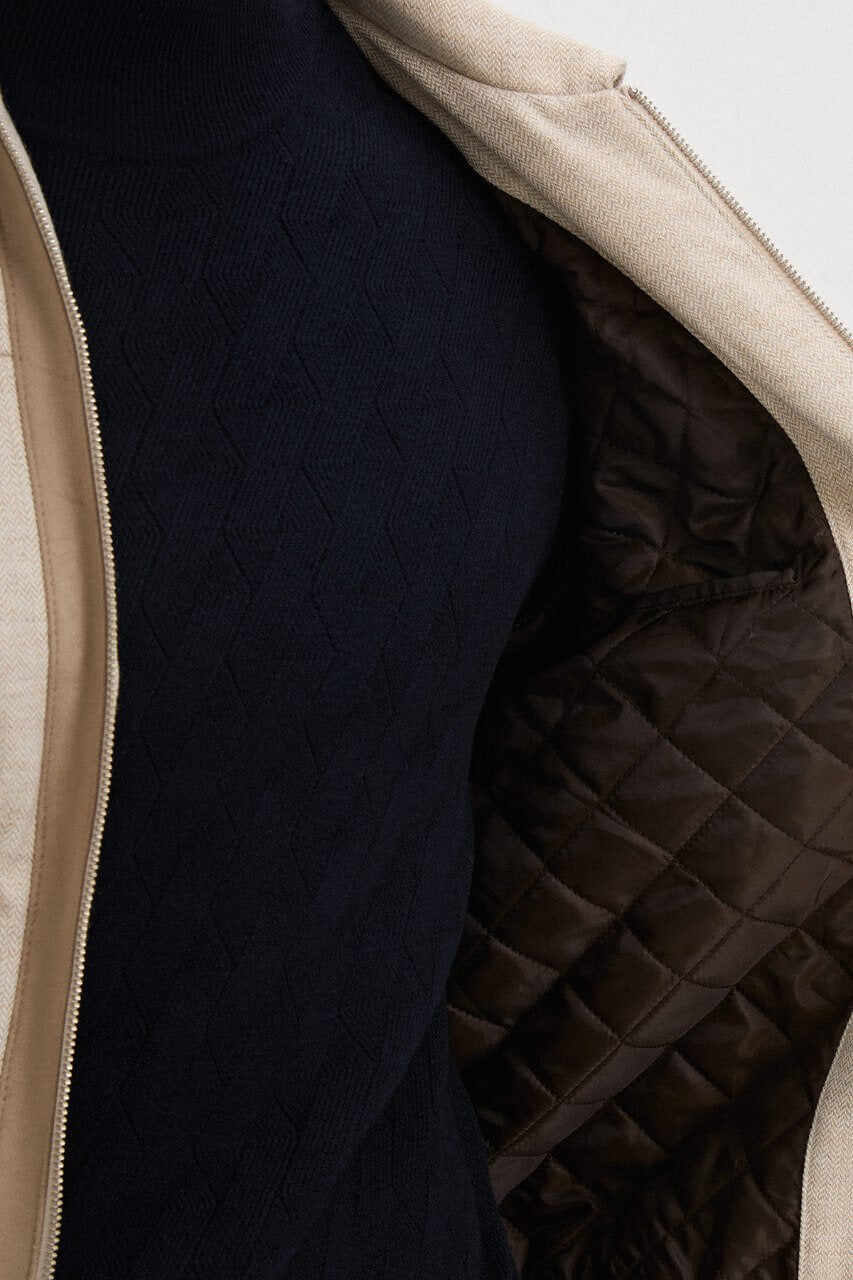 Men's beige wool-blend fall jacket with contrasting chest pockets and a classic collar.