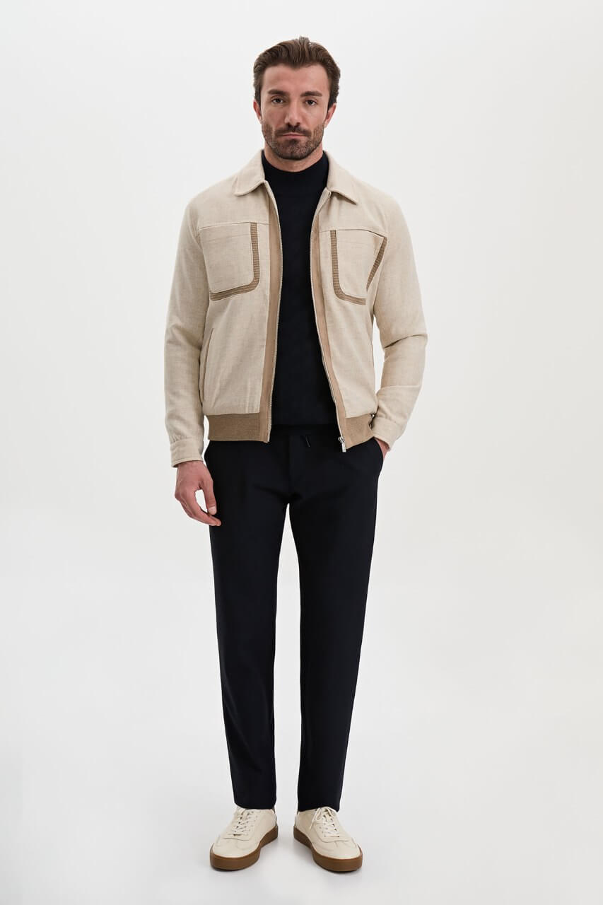 Men's beige wool-blend fall jacket with contrasting chest pockets and a classic collar.