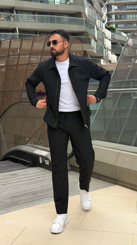 slim-fit black zip-up jacket with matching tailored trousers
