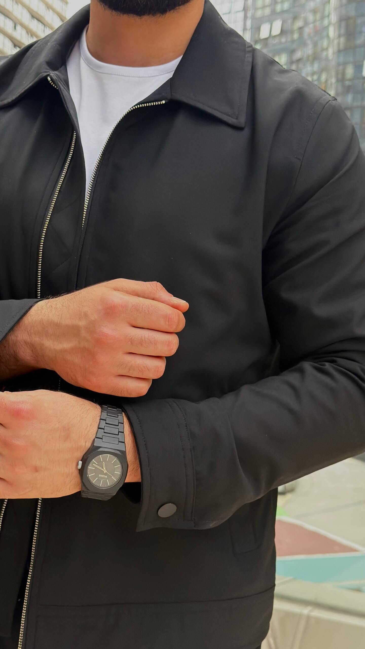 slim-fit black zip-up jacket with matching tailored trousers