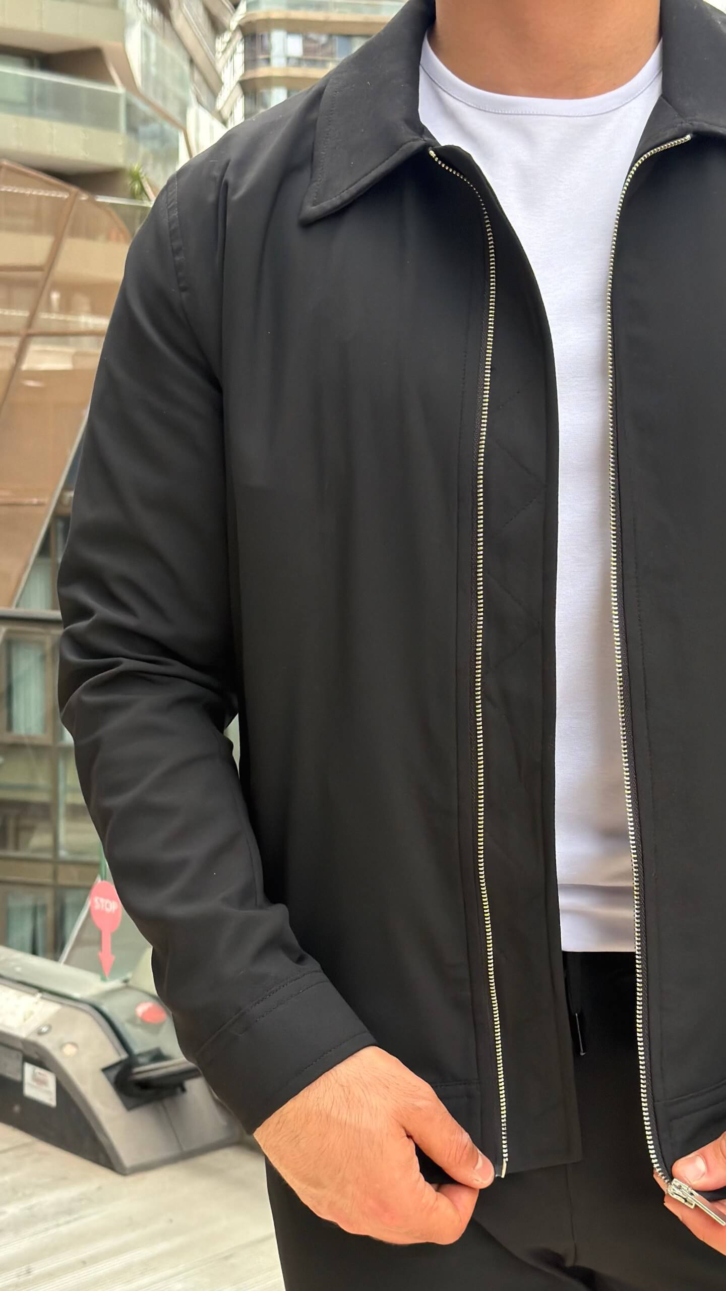 slim-fit black zip-up jacket with matching tailored trousers