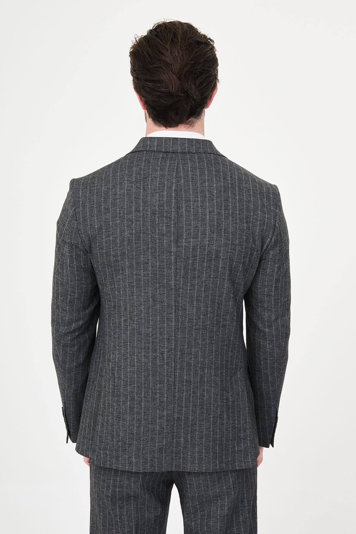 Men’s Black Charcoal Pinstripe Double-Breasted Suit on a male model, slim fit, paired with black dress shoes.