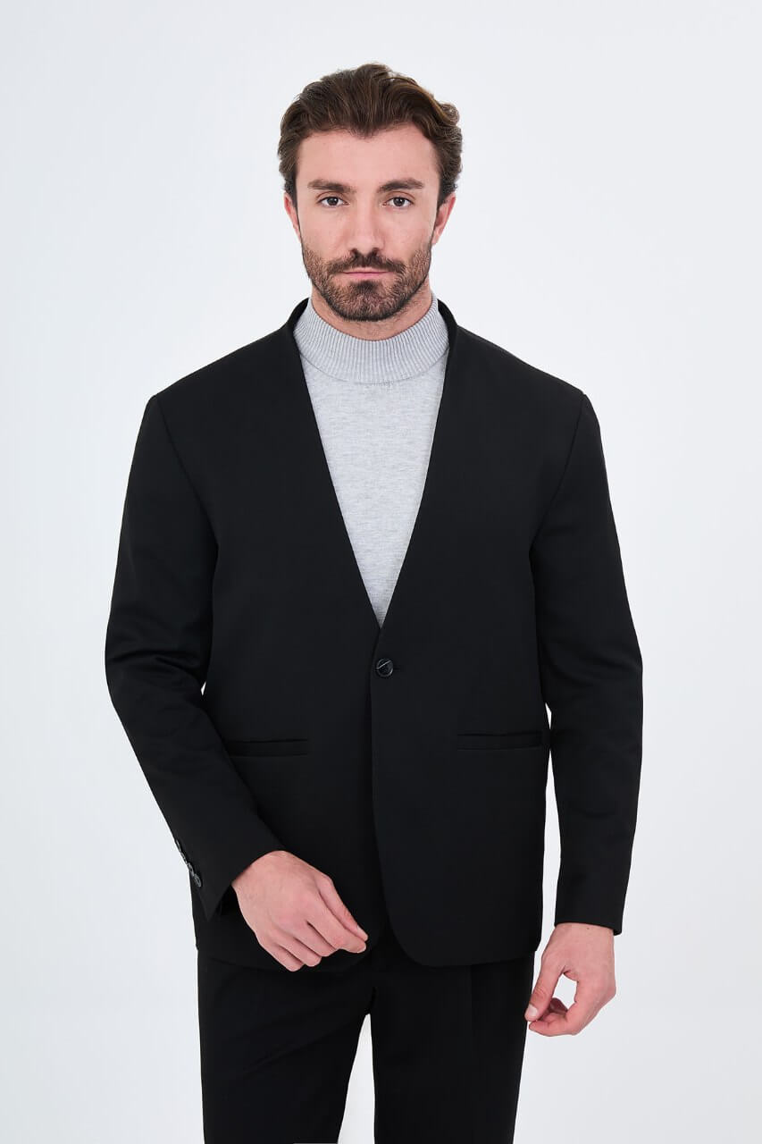 HolloMen men's black casual two-piece suit featuring a minimalist single-button jacket and matching trousers styled with a grey turtleneck.