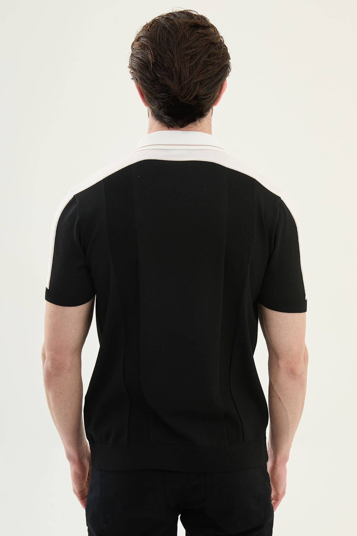 Men’s black colorblock slim fit knit polo shirt with contrast collar styled for modern summer smart-casual wear.