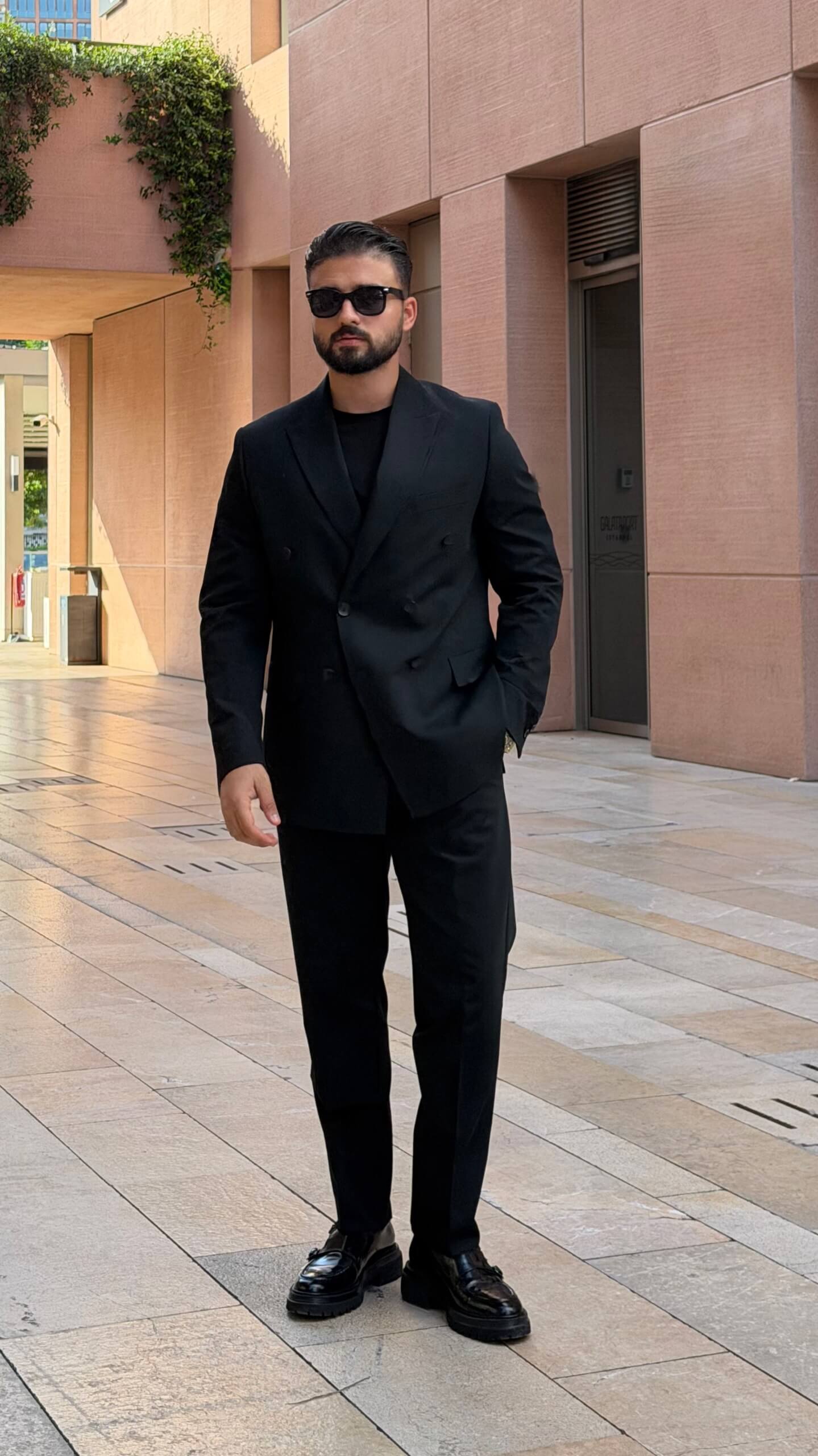 Men’s black double breasted suit with tailored jacket and trousers for formal and elegant occasions