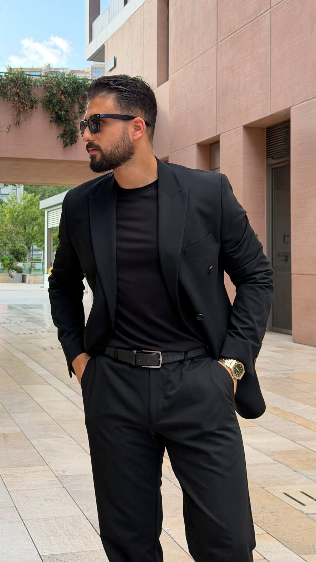 Men’s black double breasted suit with tailored jacket and trousers for formal and elegant occasions