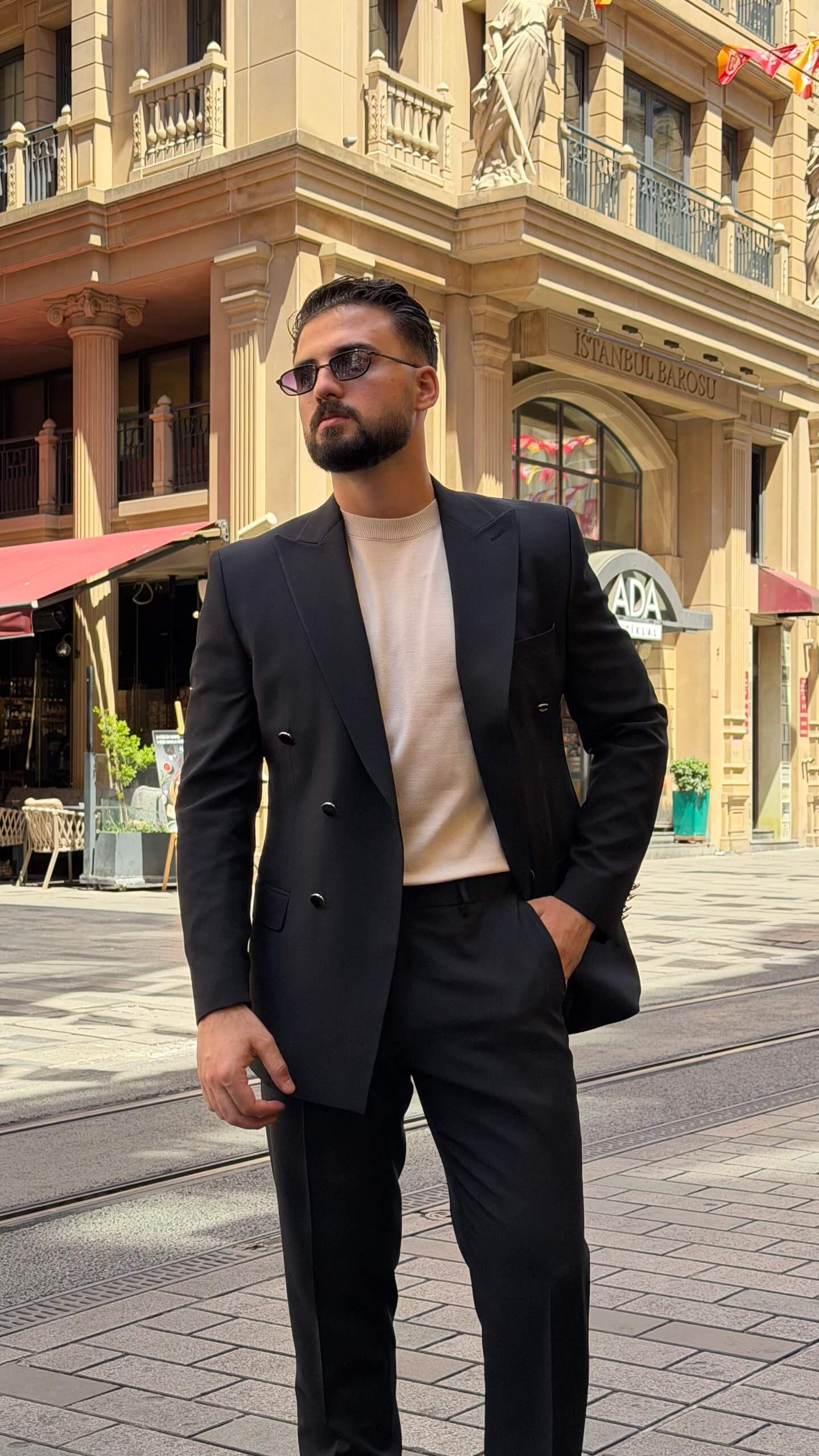 Men's black double breasted suit with tailored jacket and matching trousers