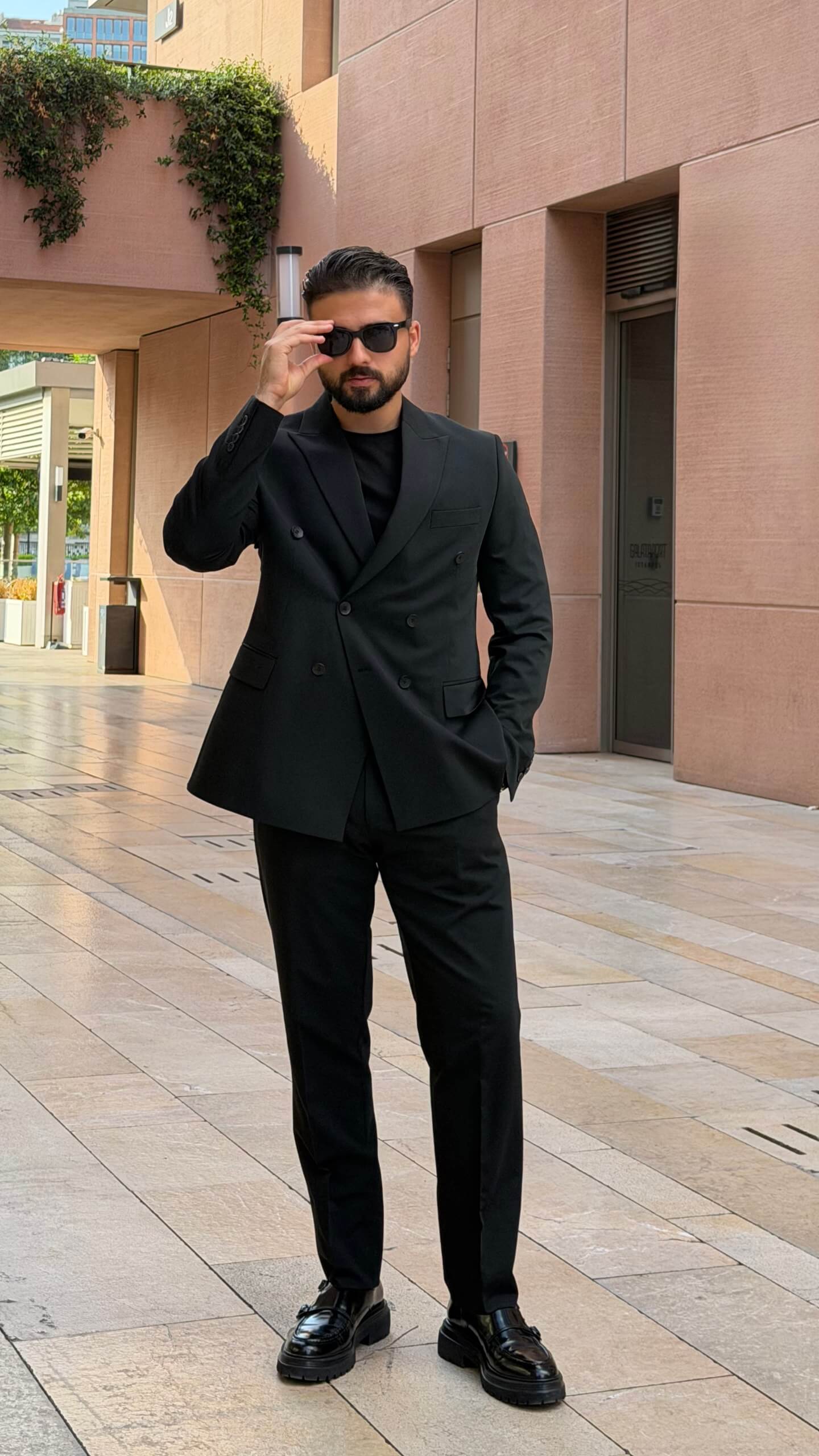 Men’s black double breasted suit with tailored jacket and trousers for formal and elegant occasions