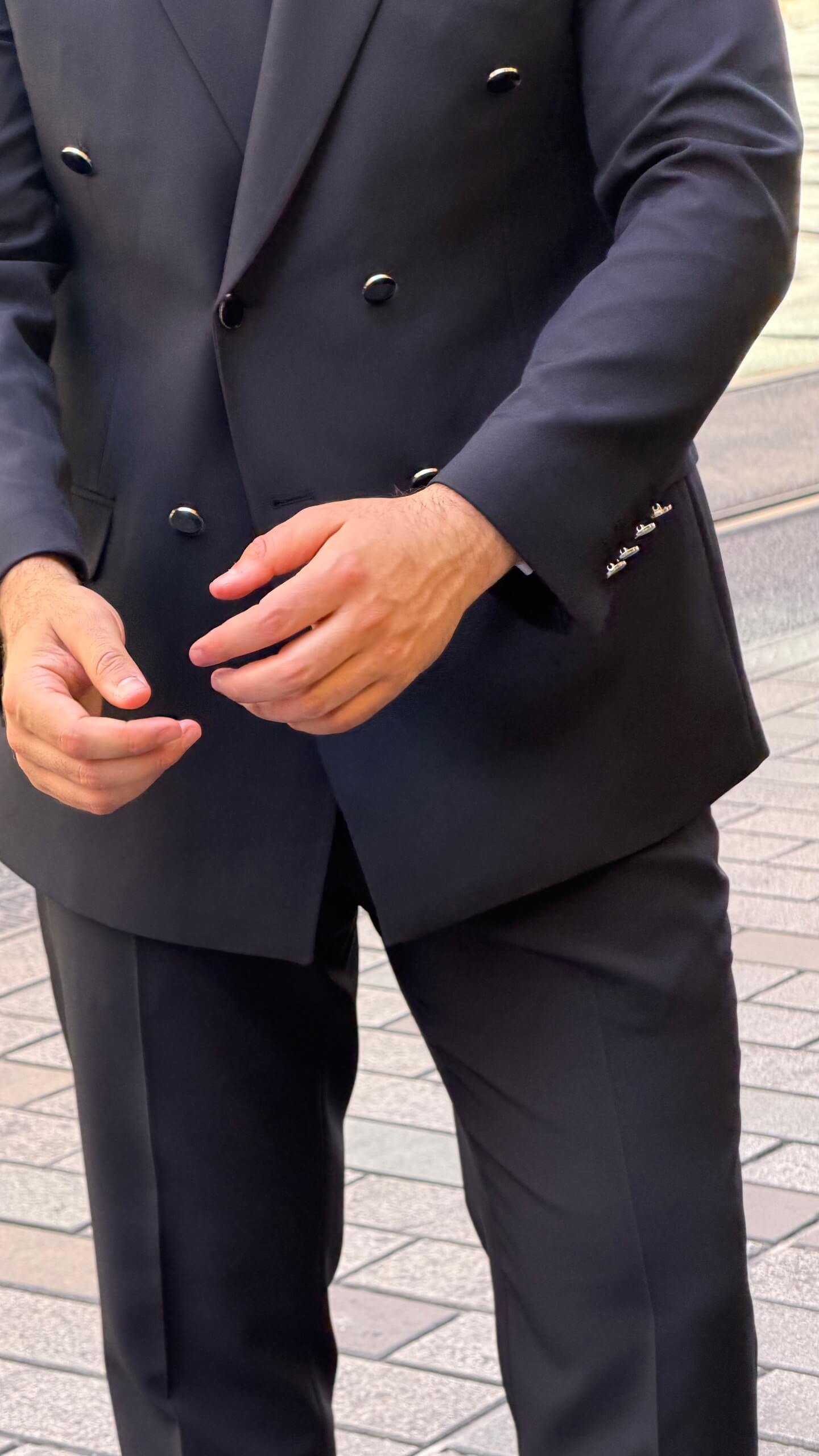 Men's black double breasted suit with tailored jacket and matching trousers