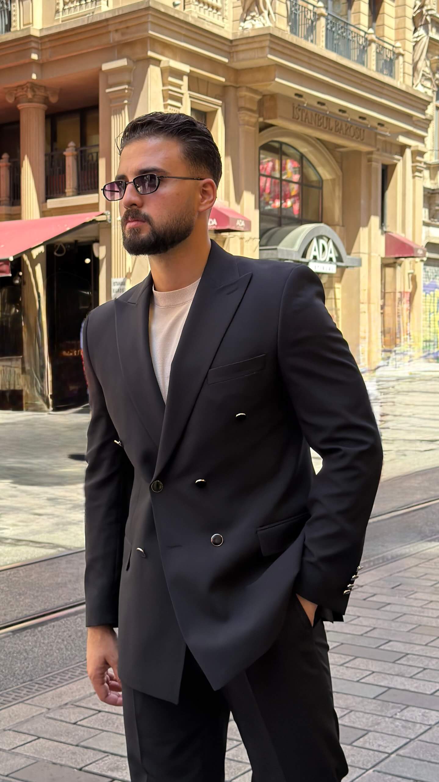 Men's black double breasted suit with tailored jacket and matching trousers