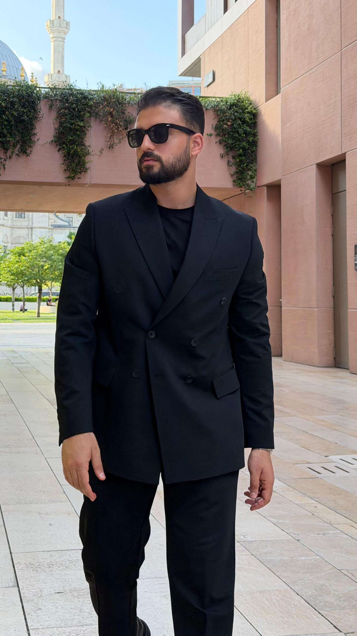 Men’s black double breasted suit with tailored jacket and trousers for formal and elegant occasions