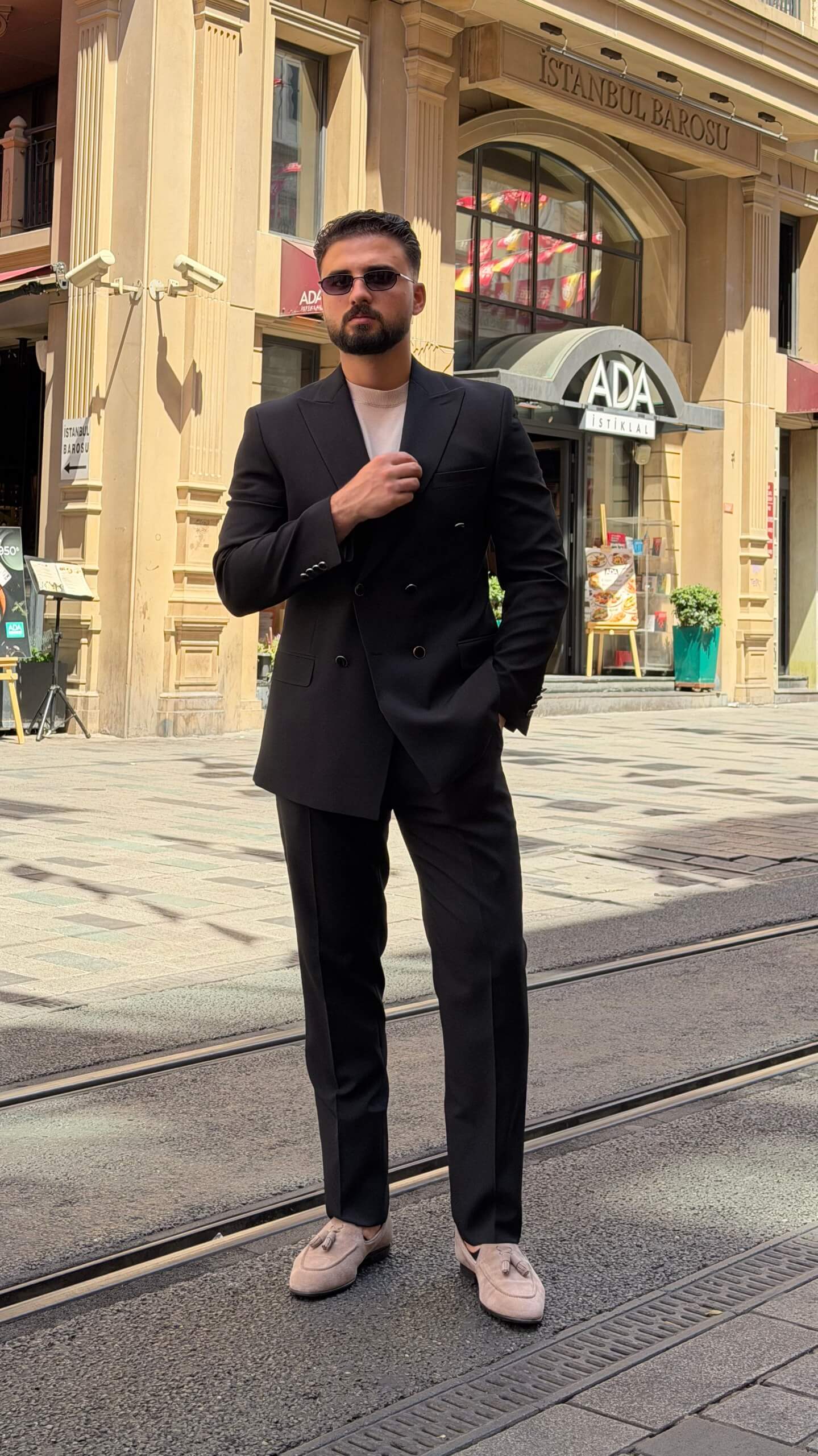 Men's black double breasted suit with tailored jacket and matching trousers