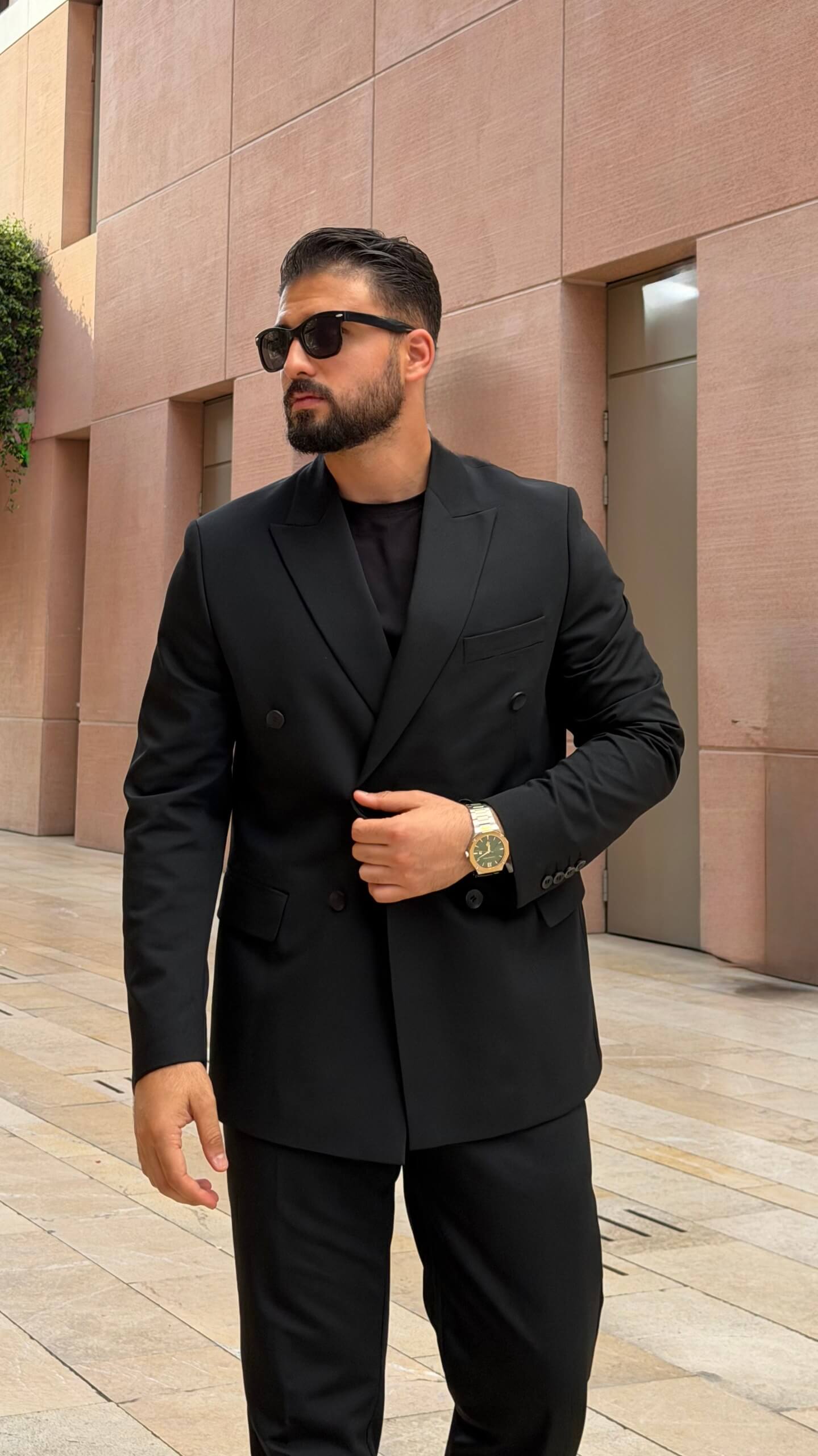 Men’s black double breasted suit with tailored jacket and trousers for formal and elegant occasions