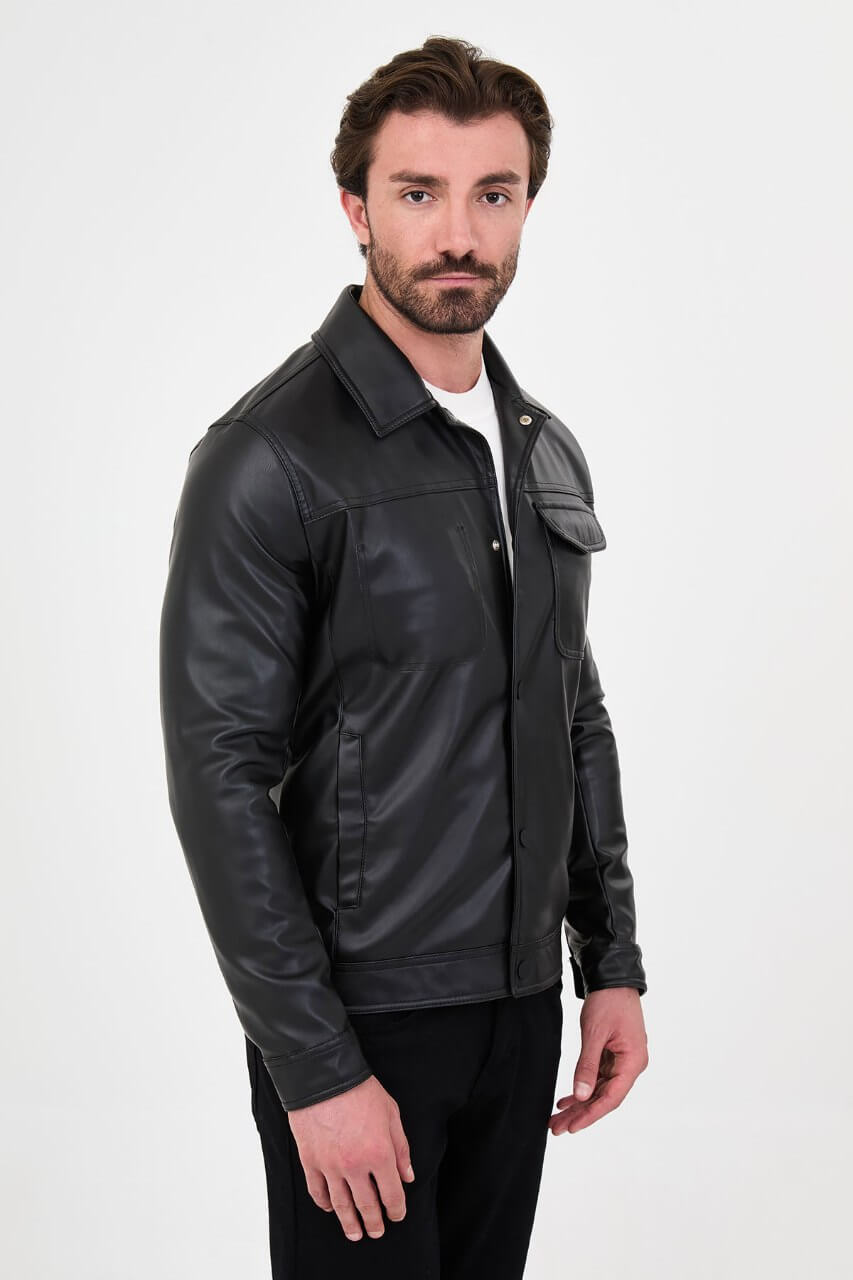 Men's black PU leather jacket styled with black trousers and a white crew-neck T-shirt.