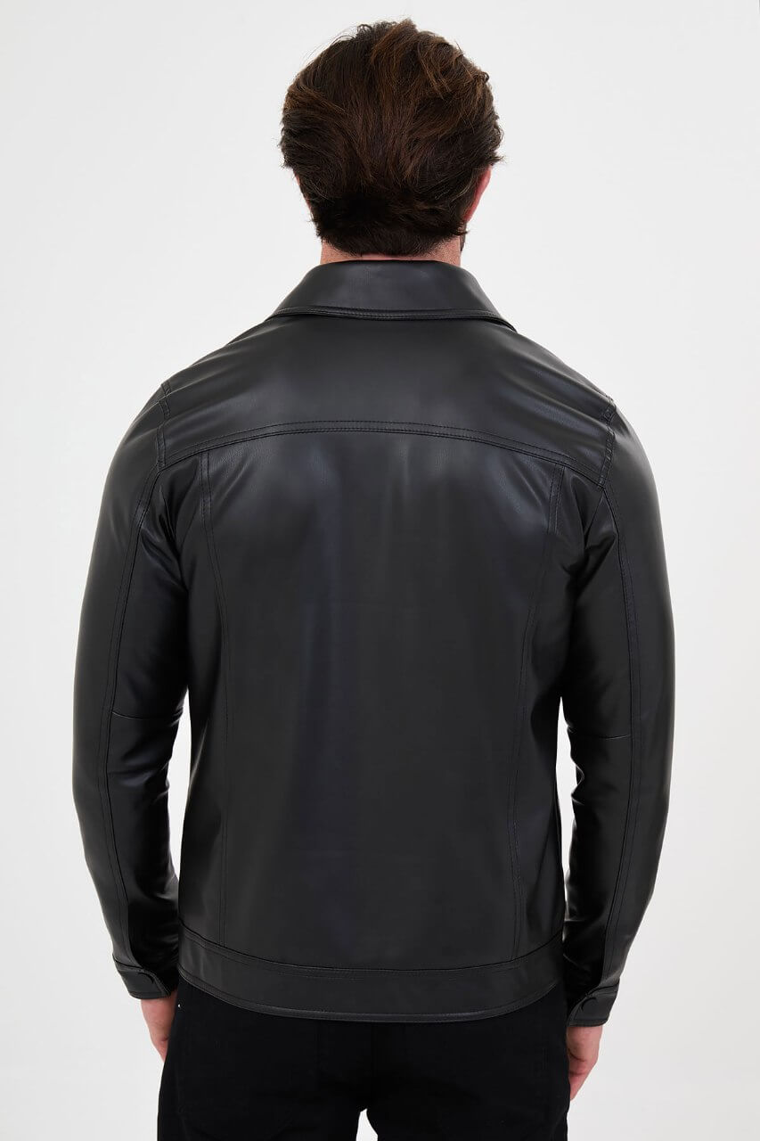Men's black PU leather jacket styled with black trousers and a white crew-neck T-shirt.