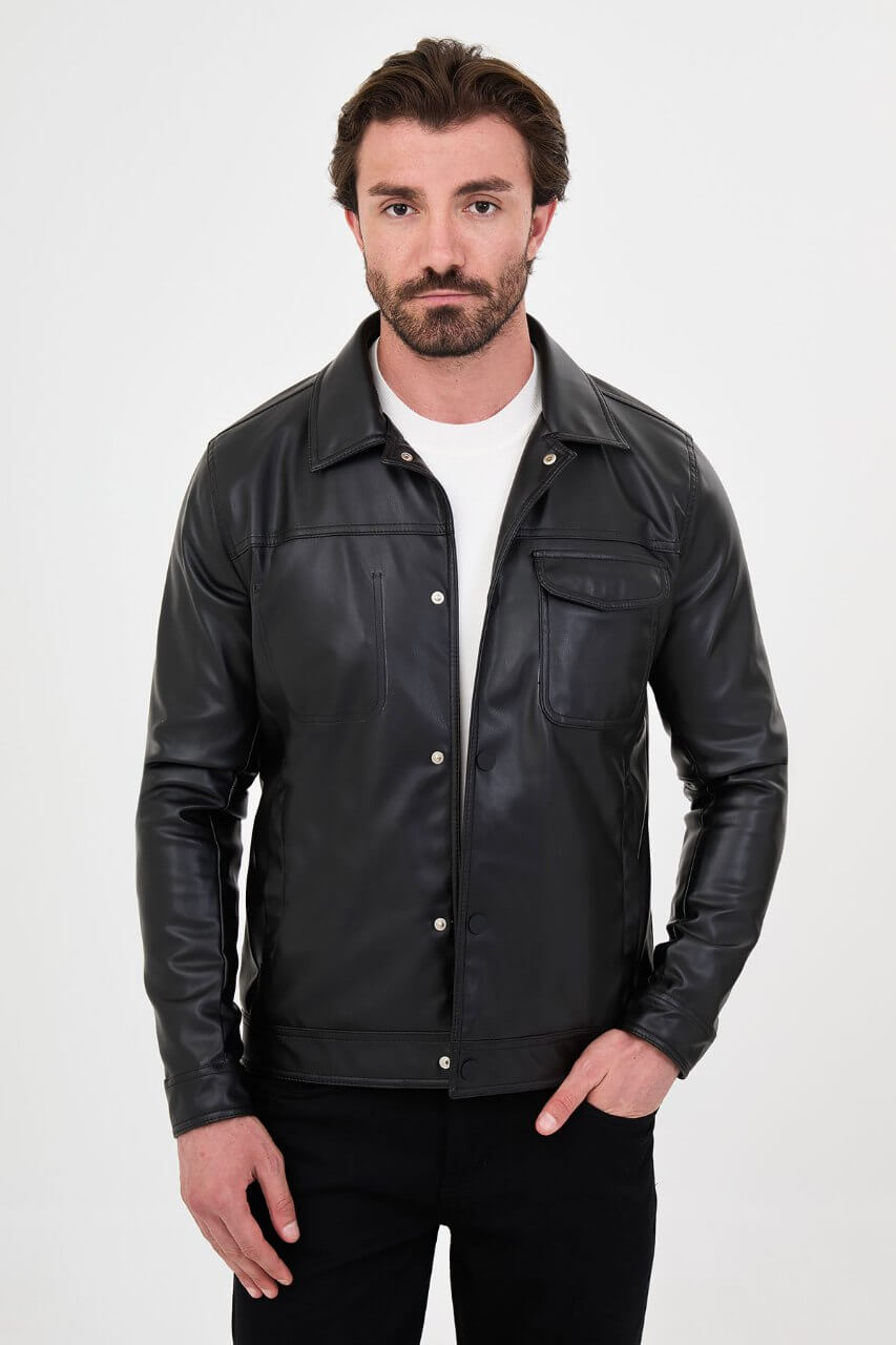 Men's black PU leather jacket styled with black trousers and a white crew-neck T-shirt.