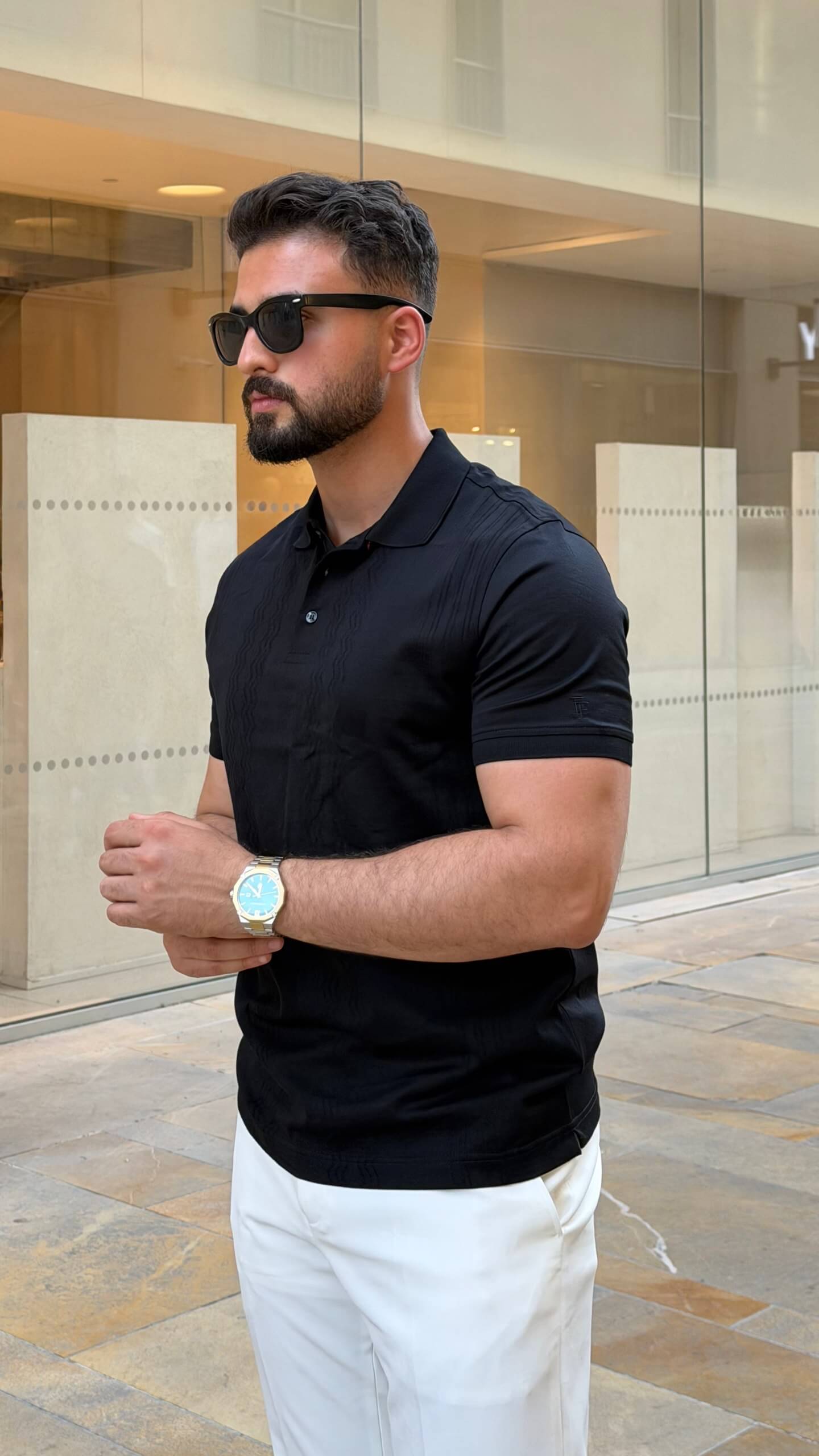 Men’s black knitted pure cotton polo shirt with textured smart-casual design