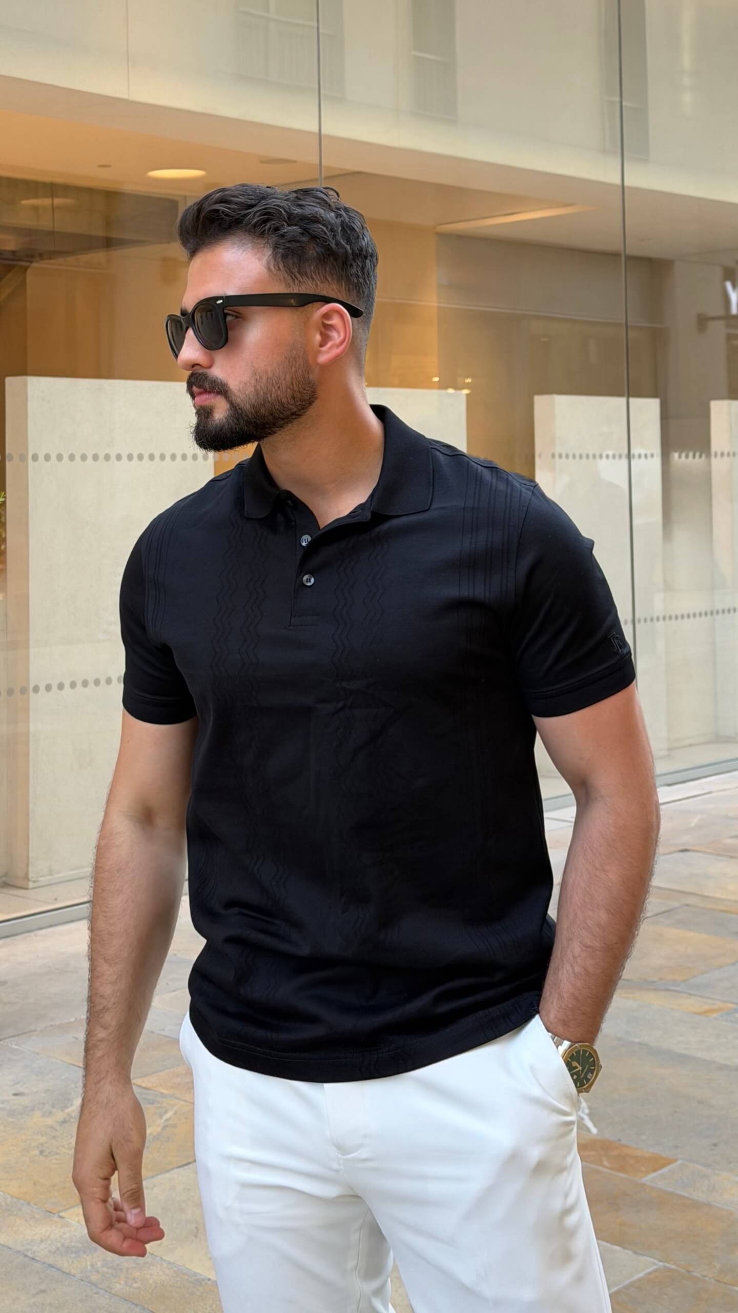 Men’s black knitted pure cotton polo shirt with textured smart-casual design