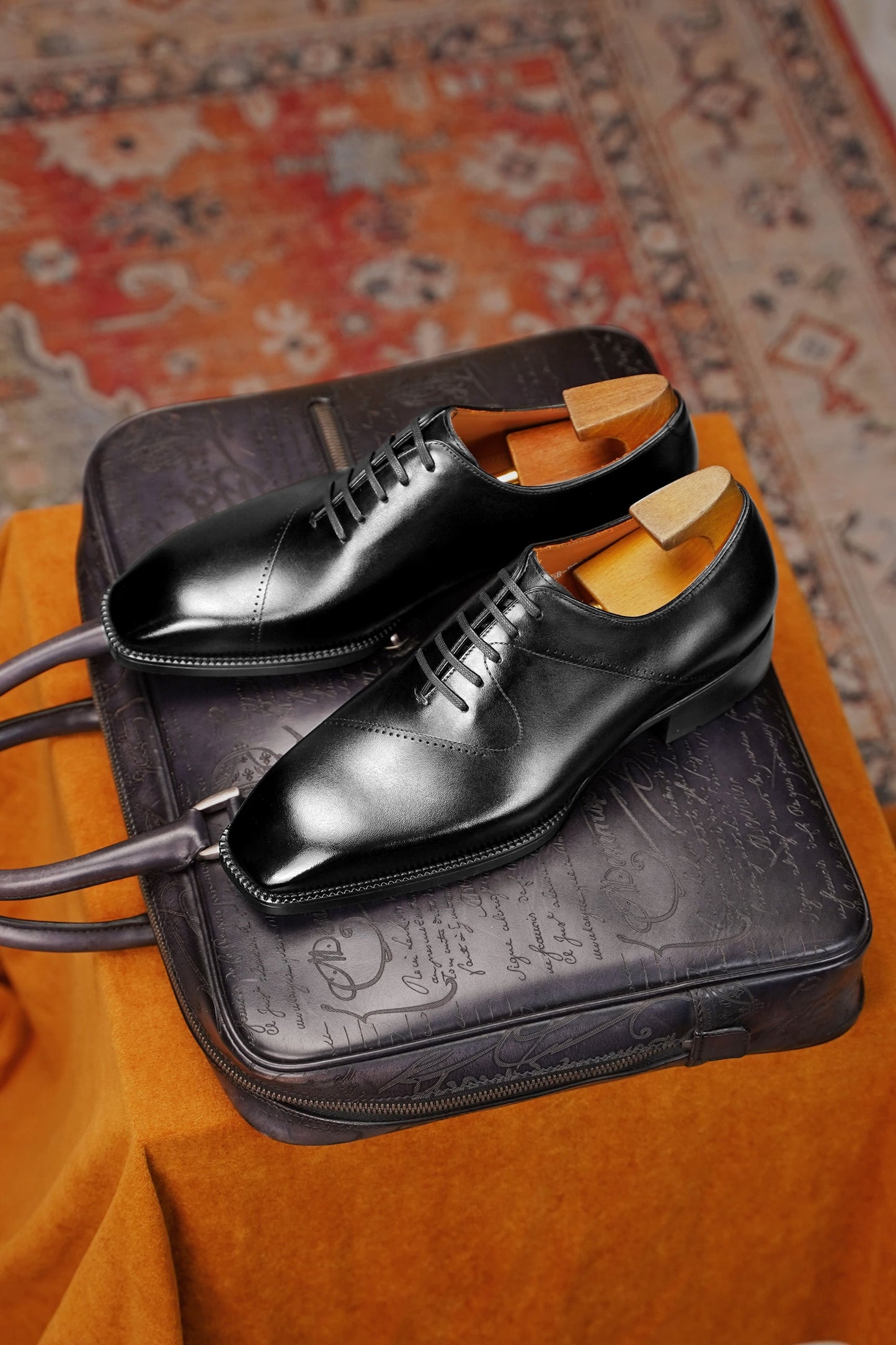 Men’s black leather cap toe Oxford dress shoes featuring a polished finish, lace-up closure, sleek tapered toe, and classic formal design.