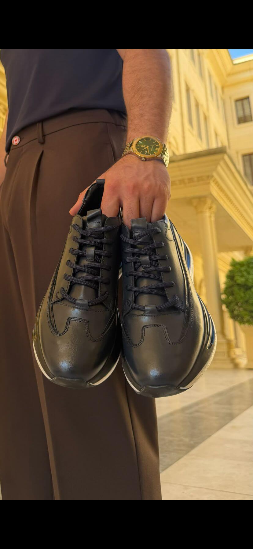 Men's black leather sneaker heel and profile detail view