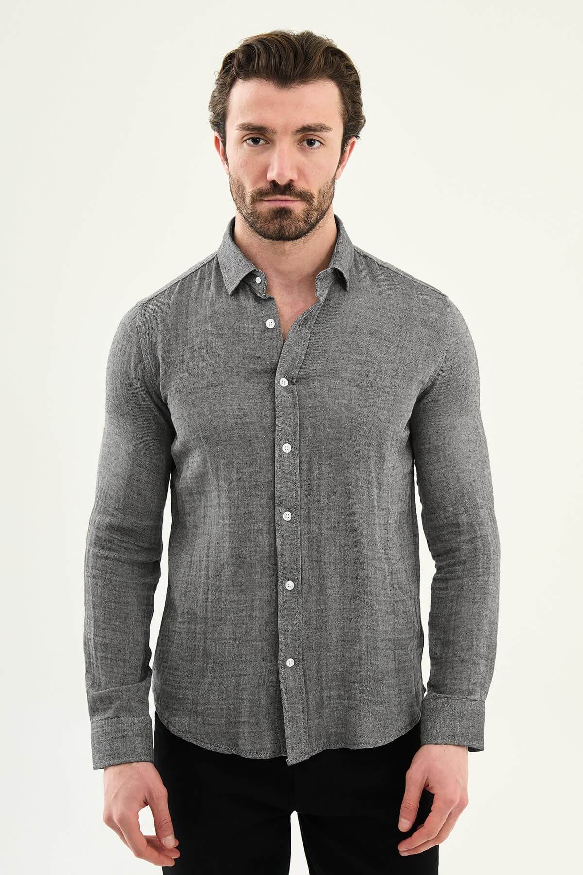 Men’s grey cotton long sleeve button-down shirt with a lightweight textured finish, styled for smart casual spring and summer outfits.