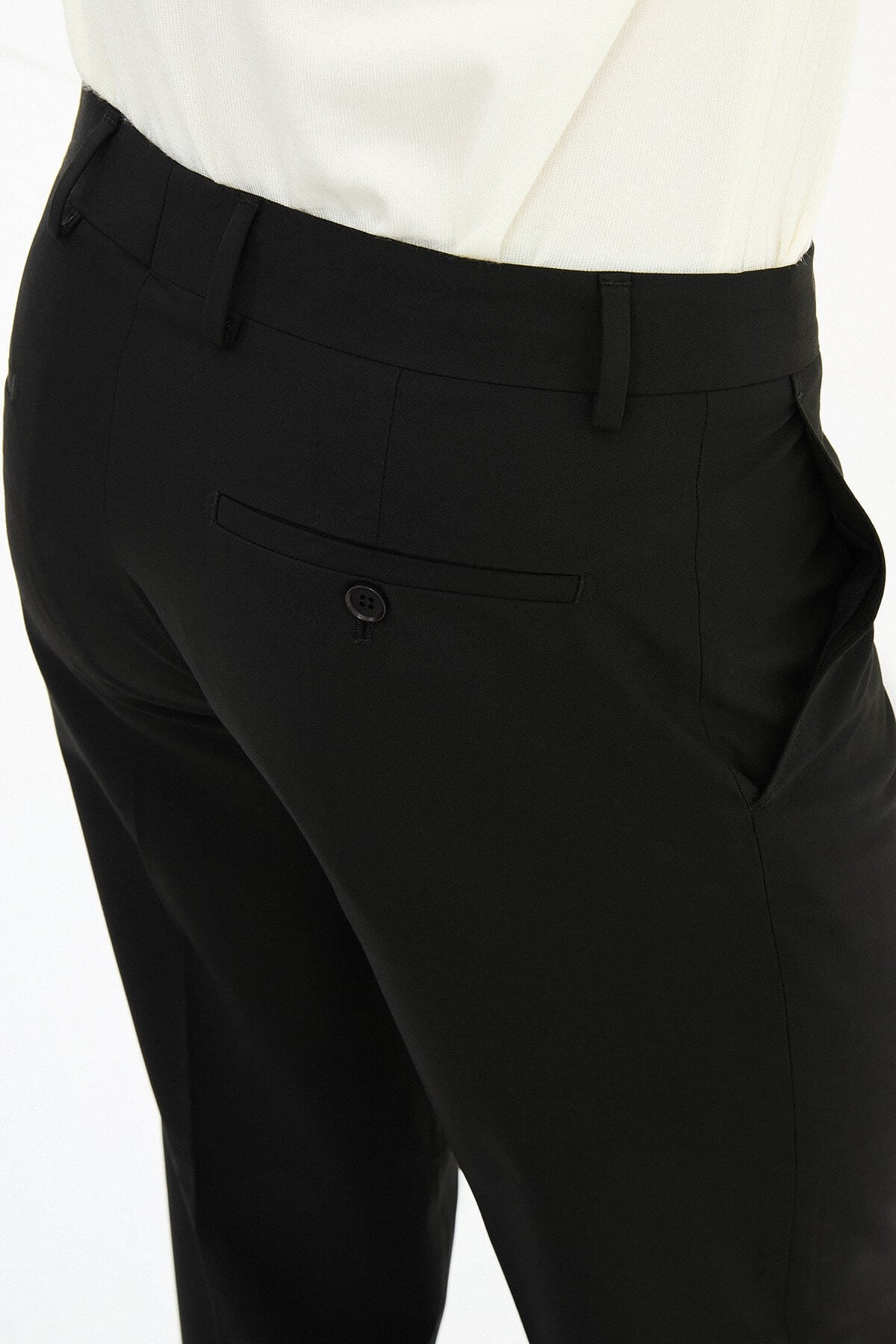 Men wearing black slim-fit formal trousers with black dress shoes, styled for professional and formal summer settings.