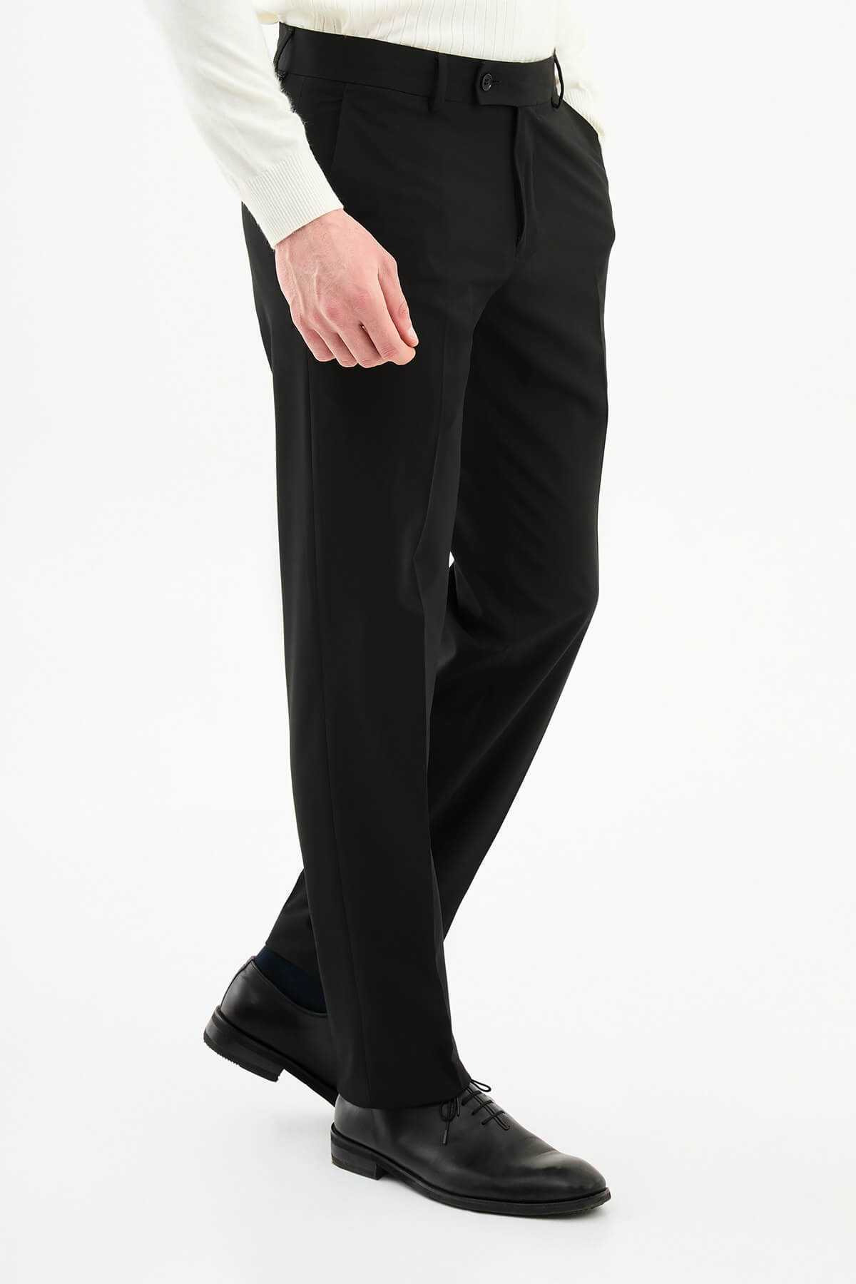 Men wearing black slim-fit formal trousers with black dress shoes, styled for professional and formal summer settings.