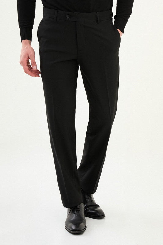 Men wearing black slim-fit classic trousers, styled with formal shoes, suitable for business and formal events.