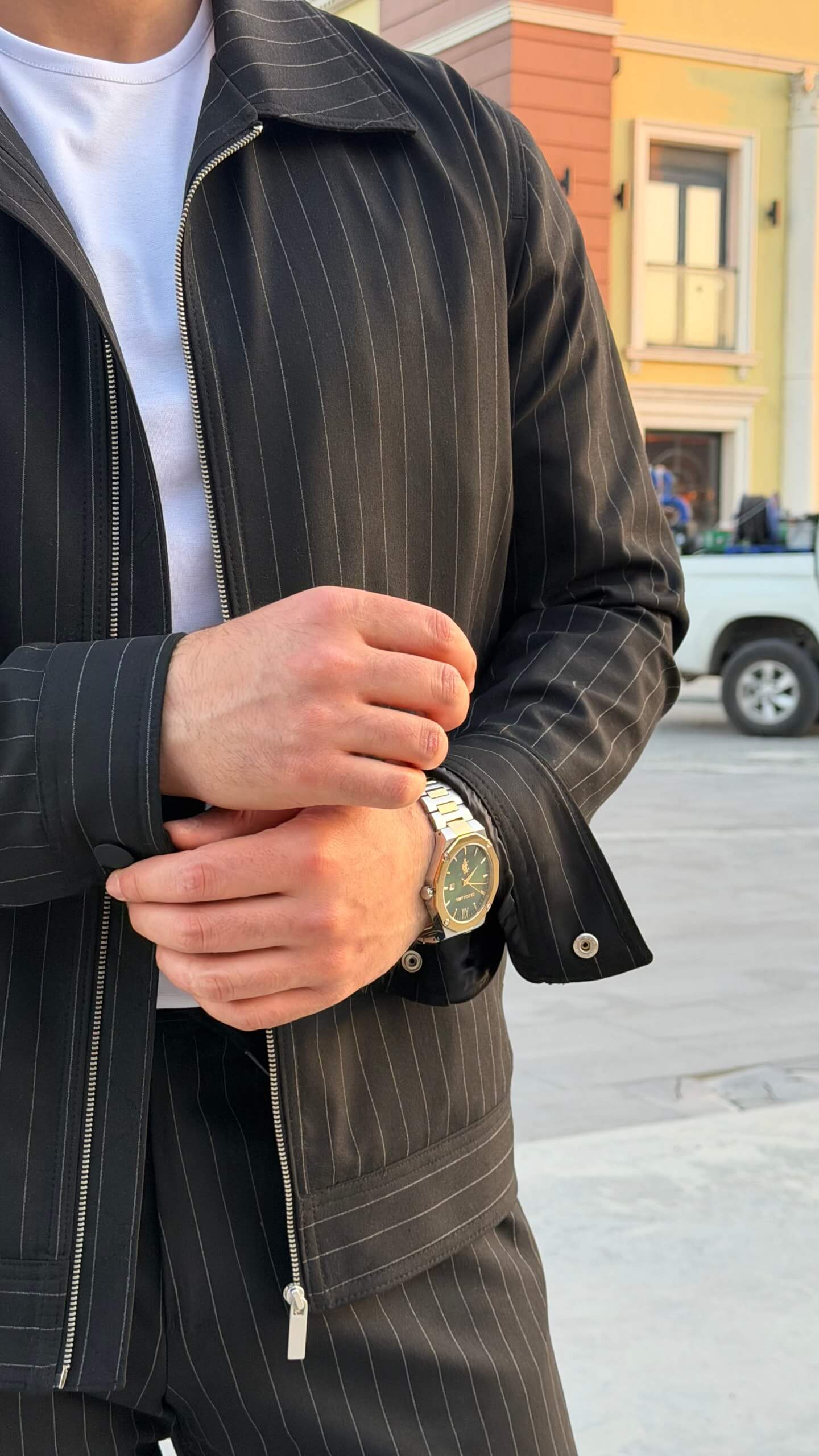black pinstripe cargo co-set outfit, featuring a zip-front slim-fit jacket with matching cargo pants