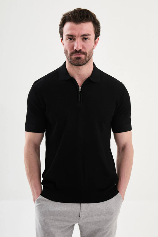Men’s black slim-fit knit polo shirt with classic collar, short sleeves, and textured knit finish for summer smart-casual style.