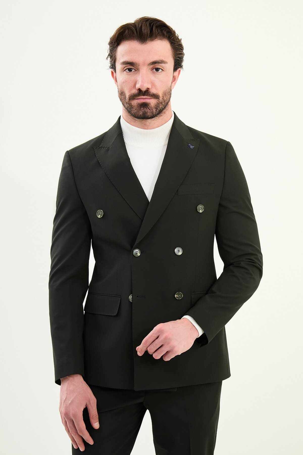 Men’s matte obsidian black slim-fit double-breasted 6x2 suit with peak lapels, cotton-wool-viscose blend with 4-way stretch for wrinkle-resistant wear, styled with a crisp white turtleneck.