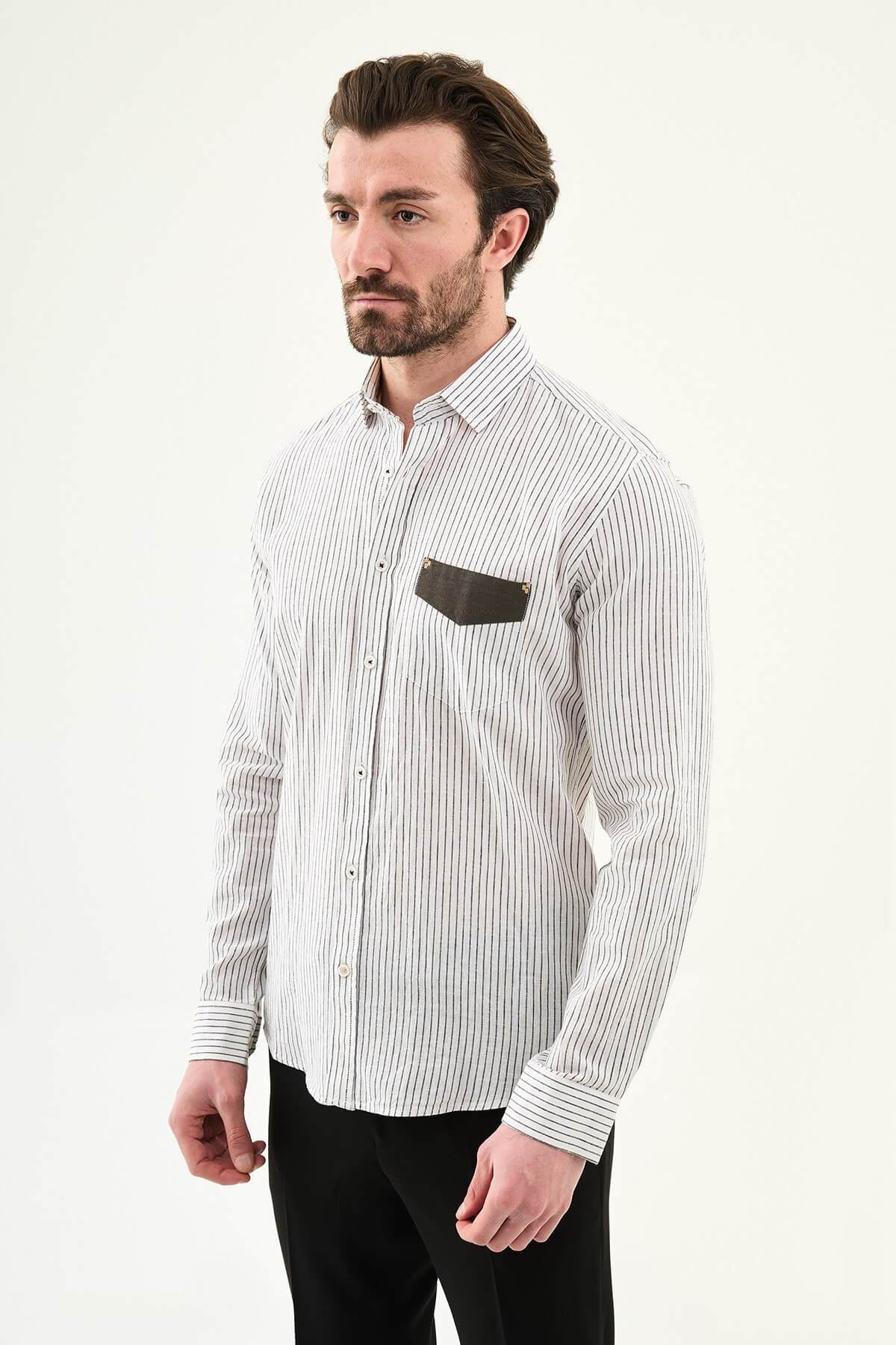 black textured slim-fit long sleeve shirt with contrast pocket panel, styled with light-colored trousers